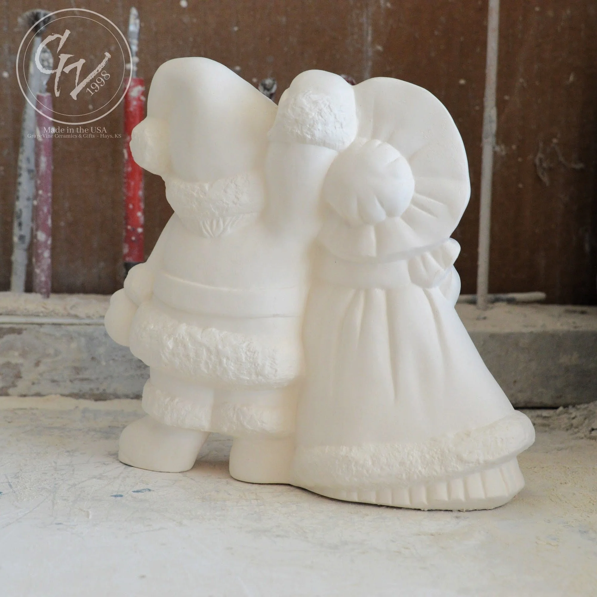 Rear profile angle profile of smooth, professionally cleaned white ceramic Santa figurines ready for acrylic paint or kiln glazing.