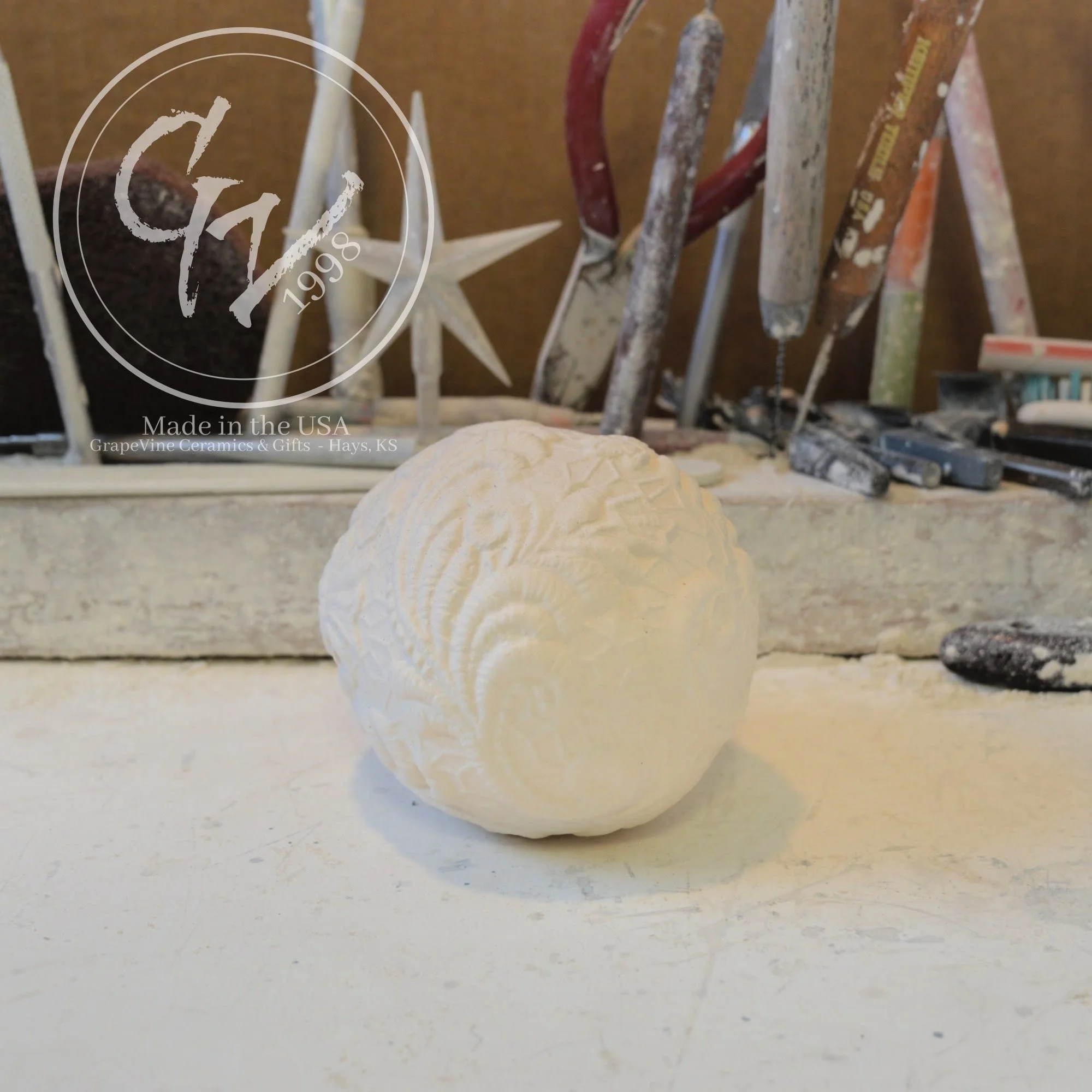 Unfinished ceramic resting lace duck egg ready for acrylic paint, glaze, or ceramic staining