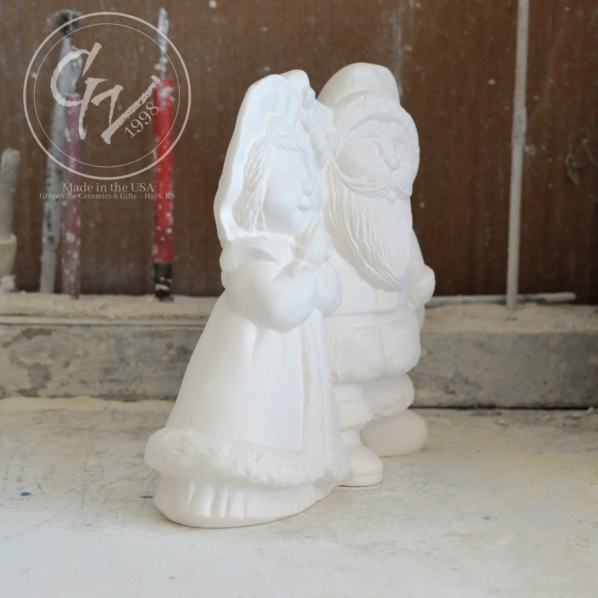 Side profile of smooth, professionally cleaned white ceramic Santa figurines ready for acrylic paint or kiln glazing.