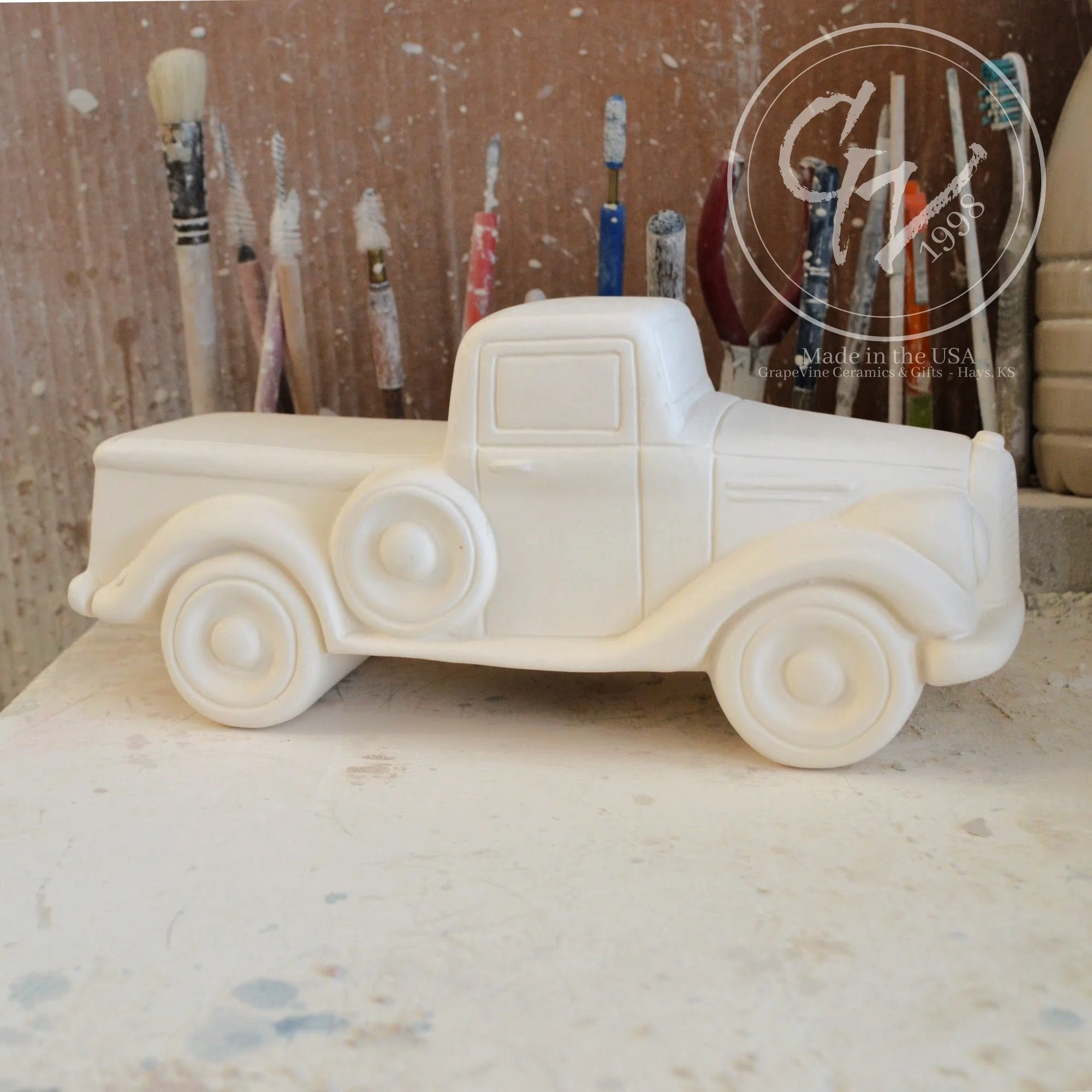 Unpainted white ceramic jalopy pickup truck bisque, Clay Magic 4208, ready for DIY painting.