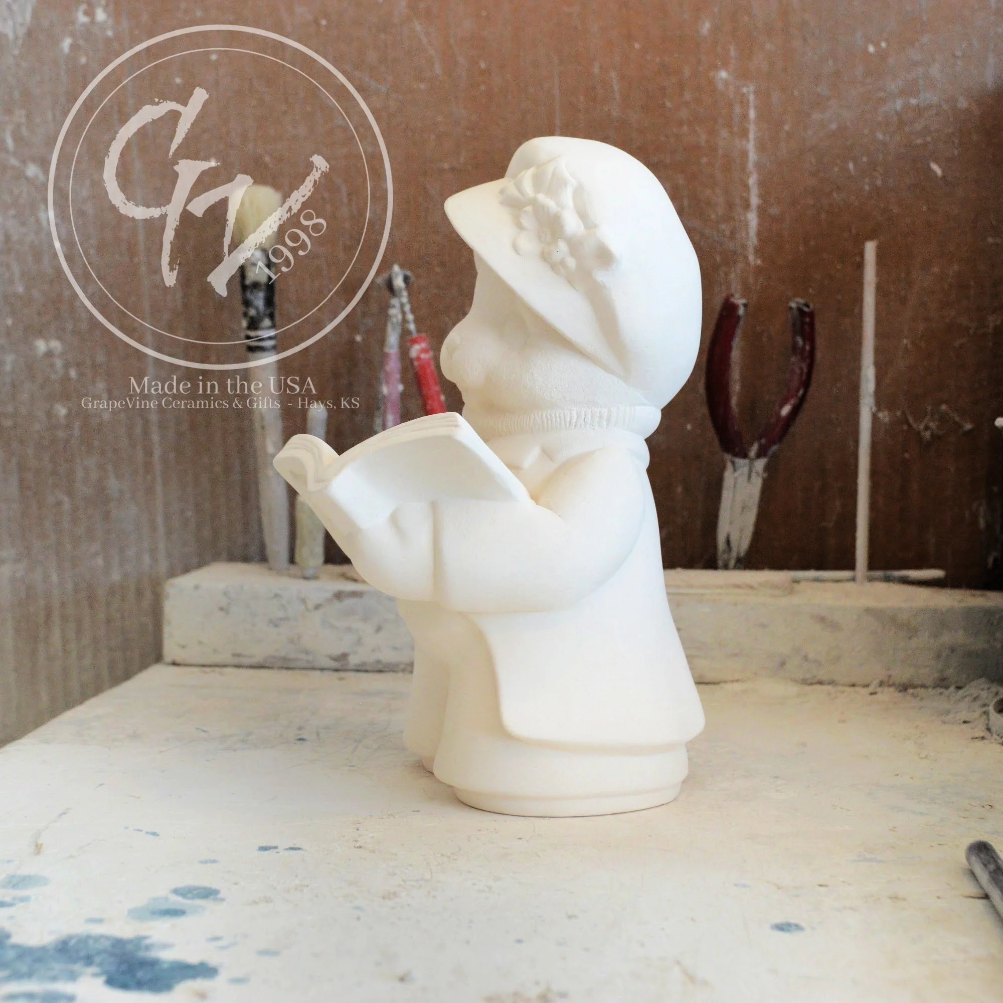 7.5-inch unfired ceramic bear showing smooth, hand-cleaned surfaces ready for painting.