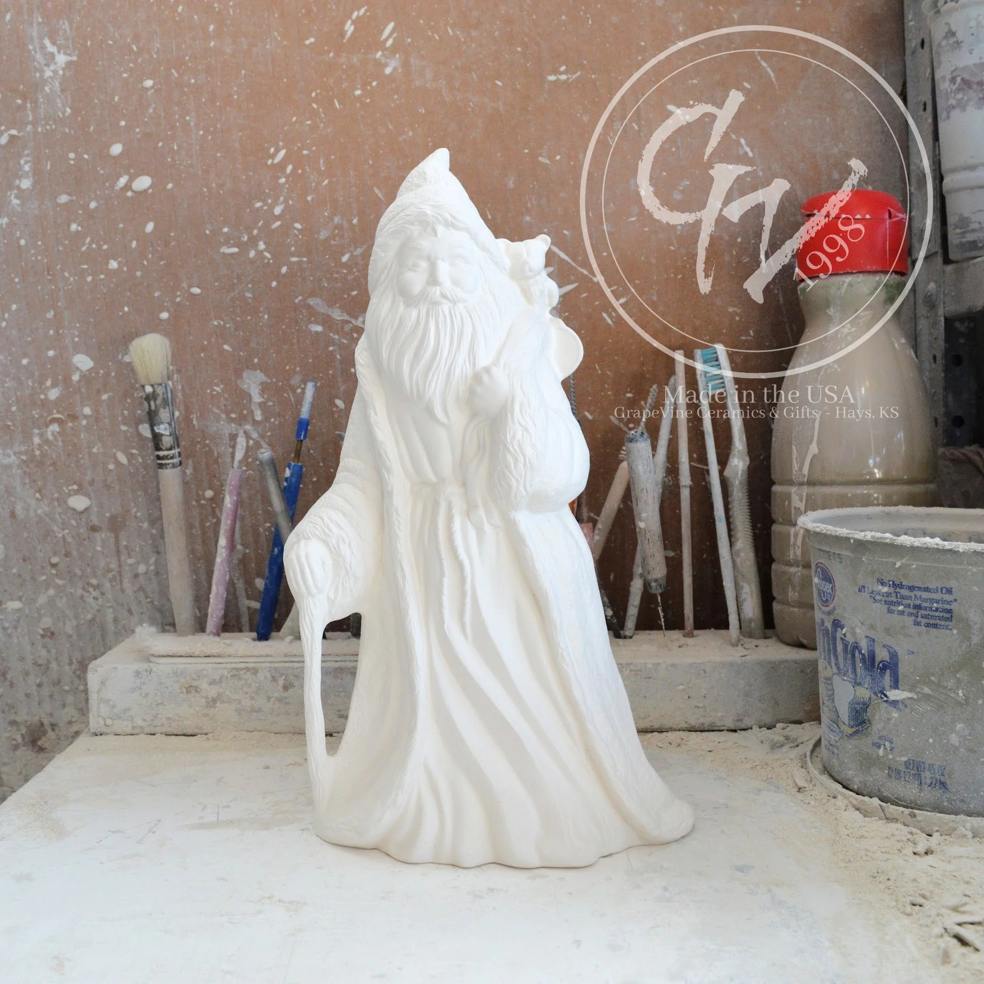 Rare 10-inch unpainted French Santa ceramic bisque with a hooded cloak and vintage Old World features.