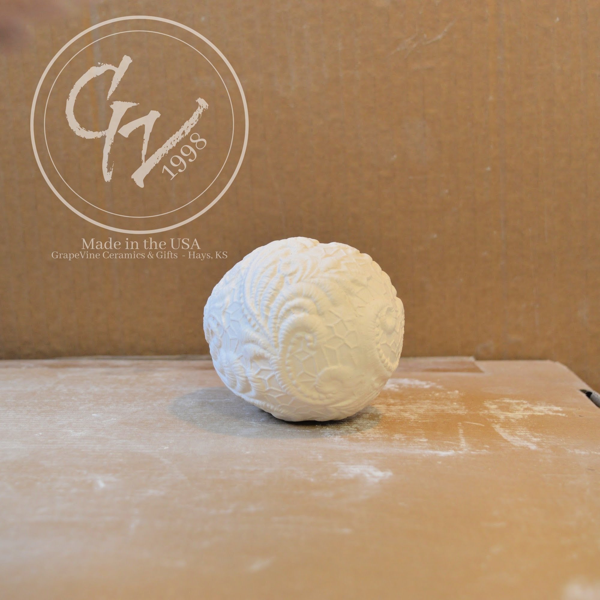 Unfinished ceramic resting lace duck egg ready for acrylic paint, glaze, or ceramic staining