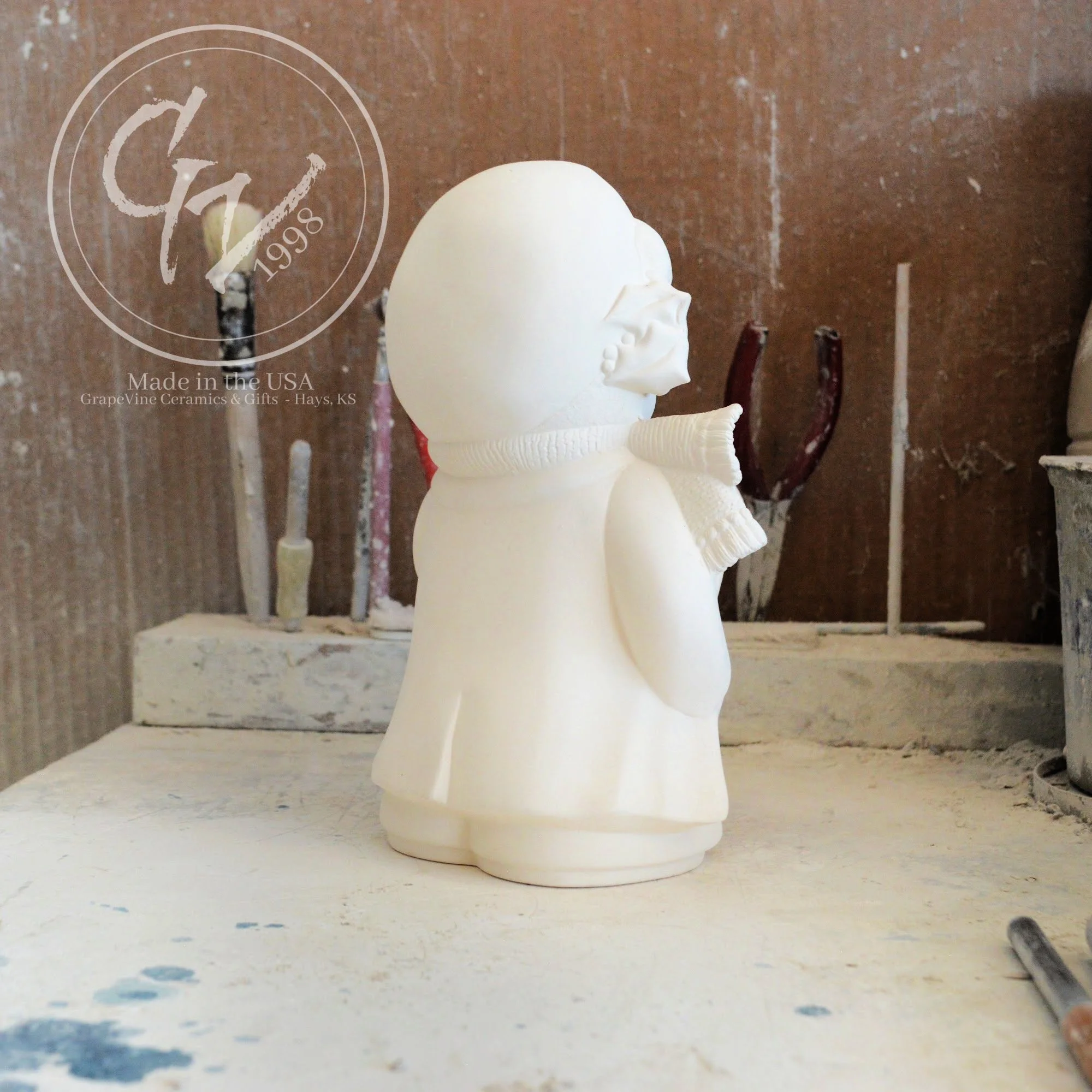 Rear angle profile of the ceramic Christmas bear showing clean mold lines and high-quality bisque finish.