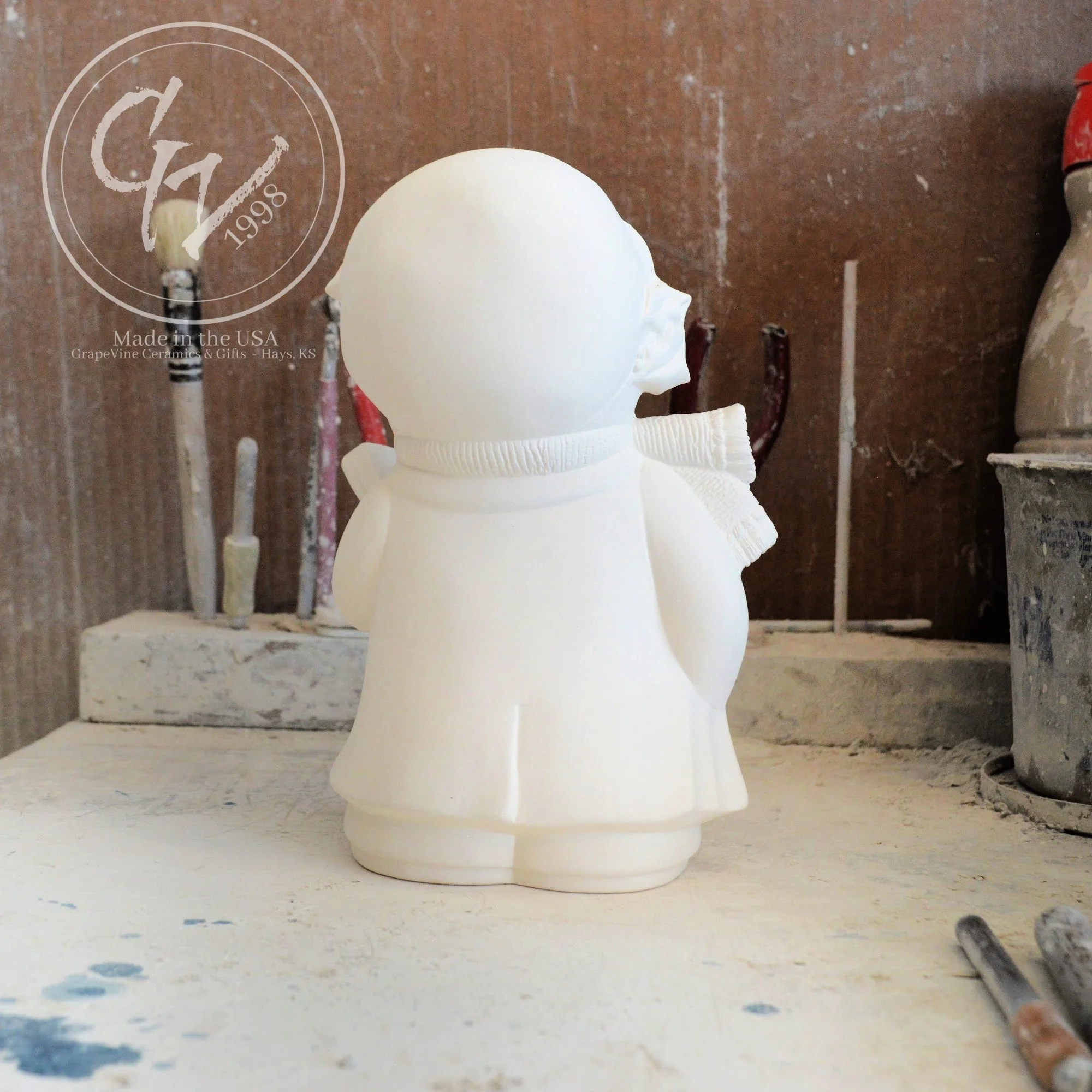 Back profile of the ceramic Christmas bear showing clean mold lines and high-quality bisque finish.