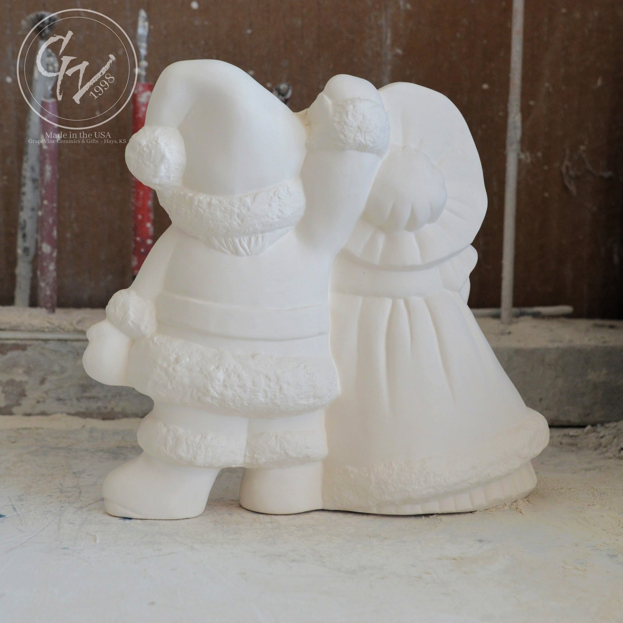 Rear profile of smooth, professionally cleaned white ceramic Santa figurines ready for acrylic paint or kiln glazing.