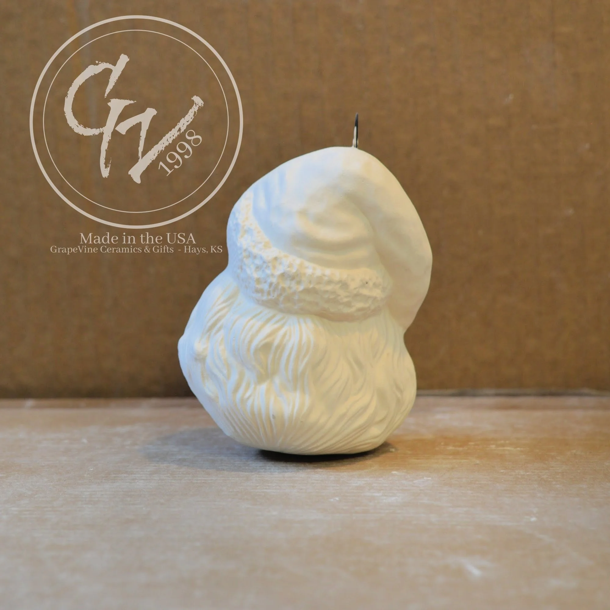 Rear view Hand-poured Santa Head ceramic ornament ready to paint