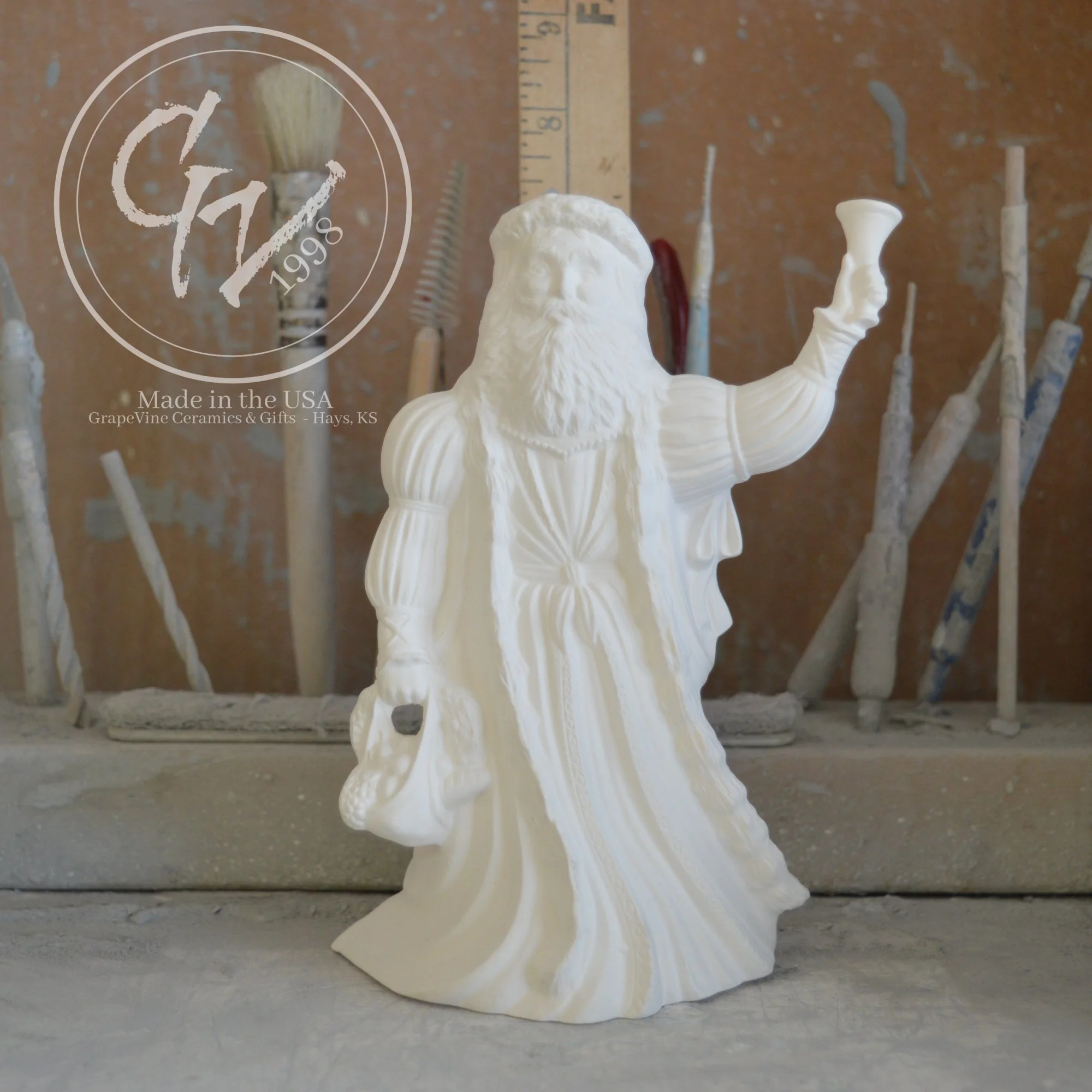 Small unpainted English Santa ceramic bisque figurine, 6 inches tall, featuring a traditional long robe and staff.