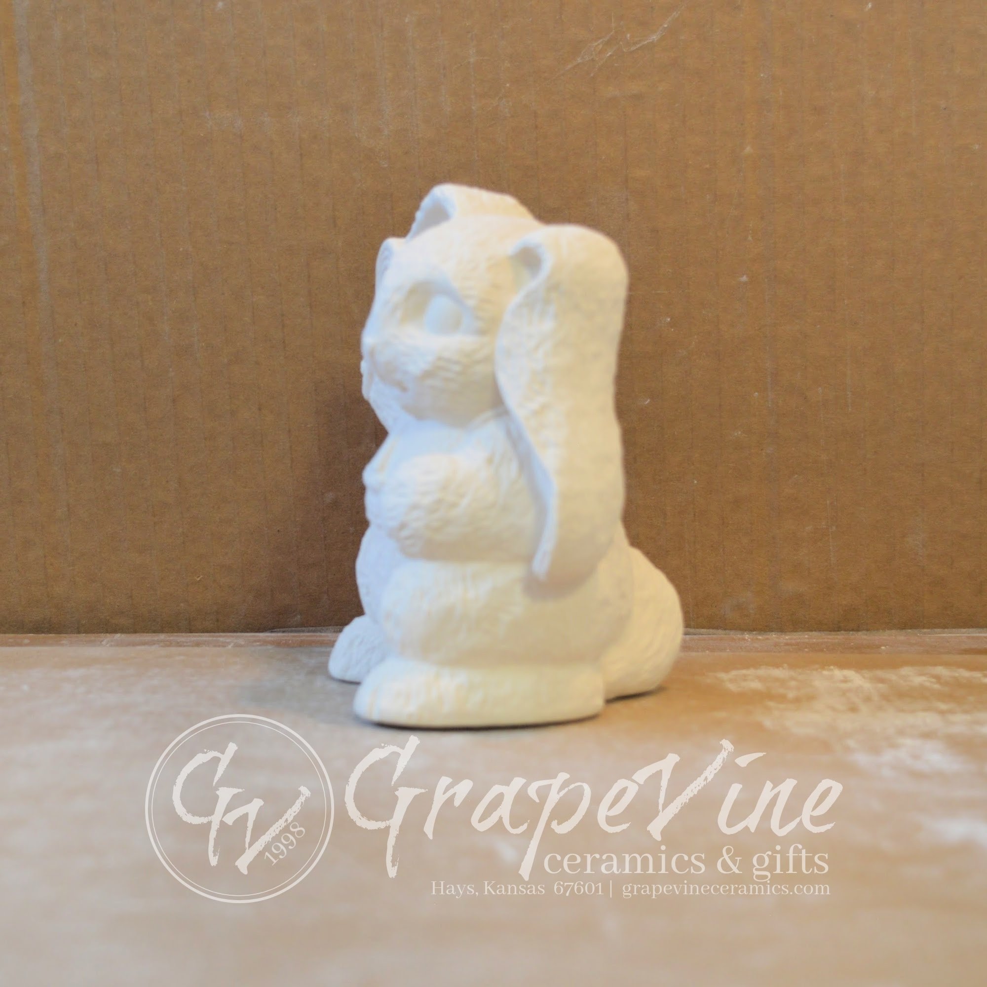 Side profile of ready-to-paint Jelly Bean Bunny ceramic rabbit bisque