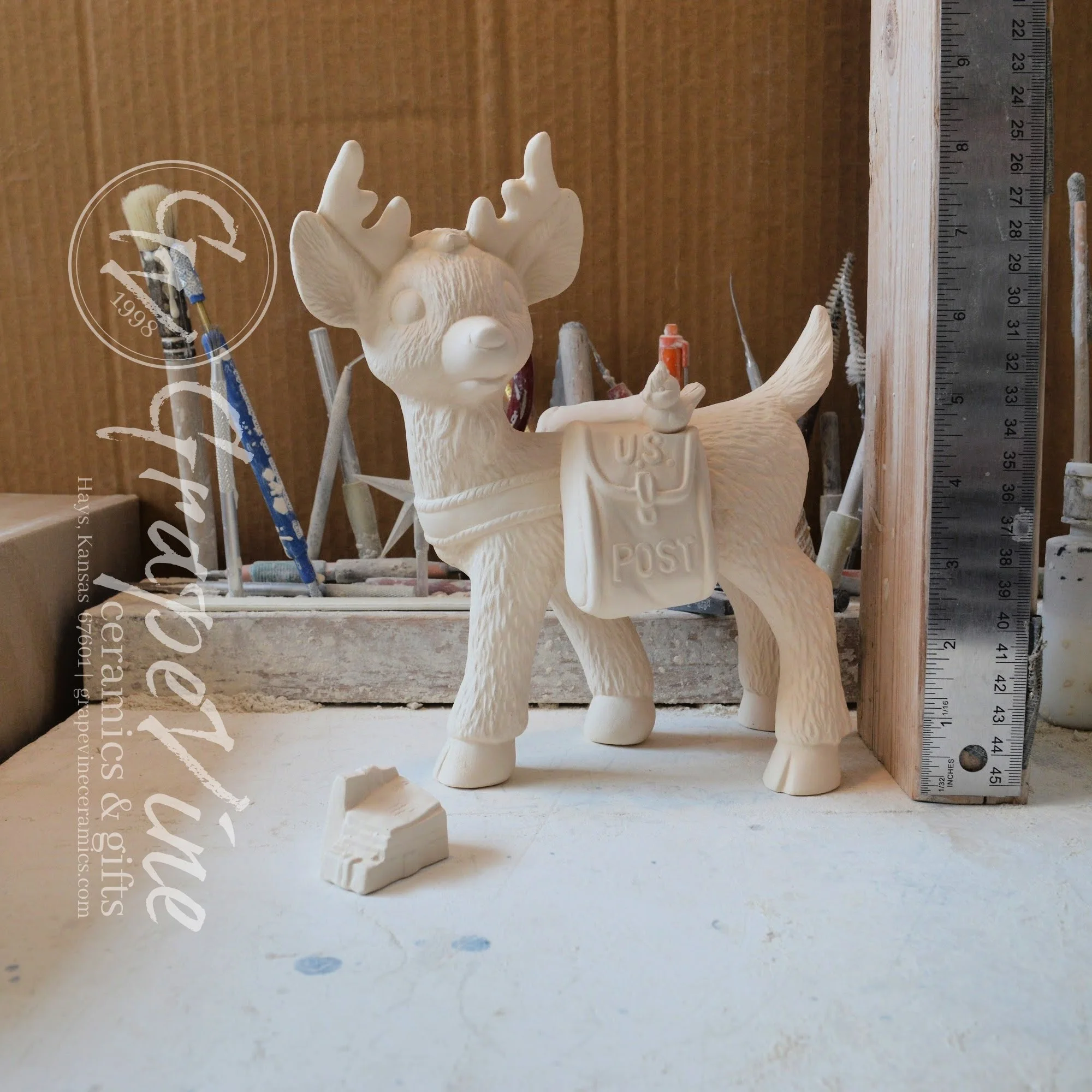 Unpainted Reindeer Postman ceramic figurine – Kimple mold with ruler for scale