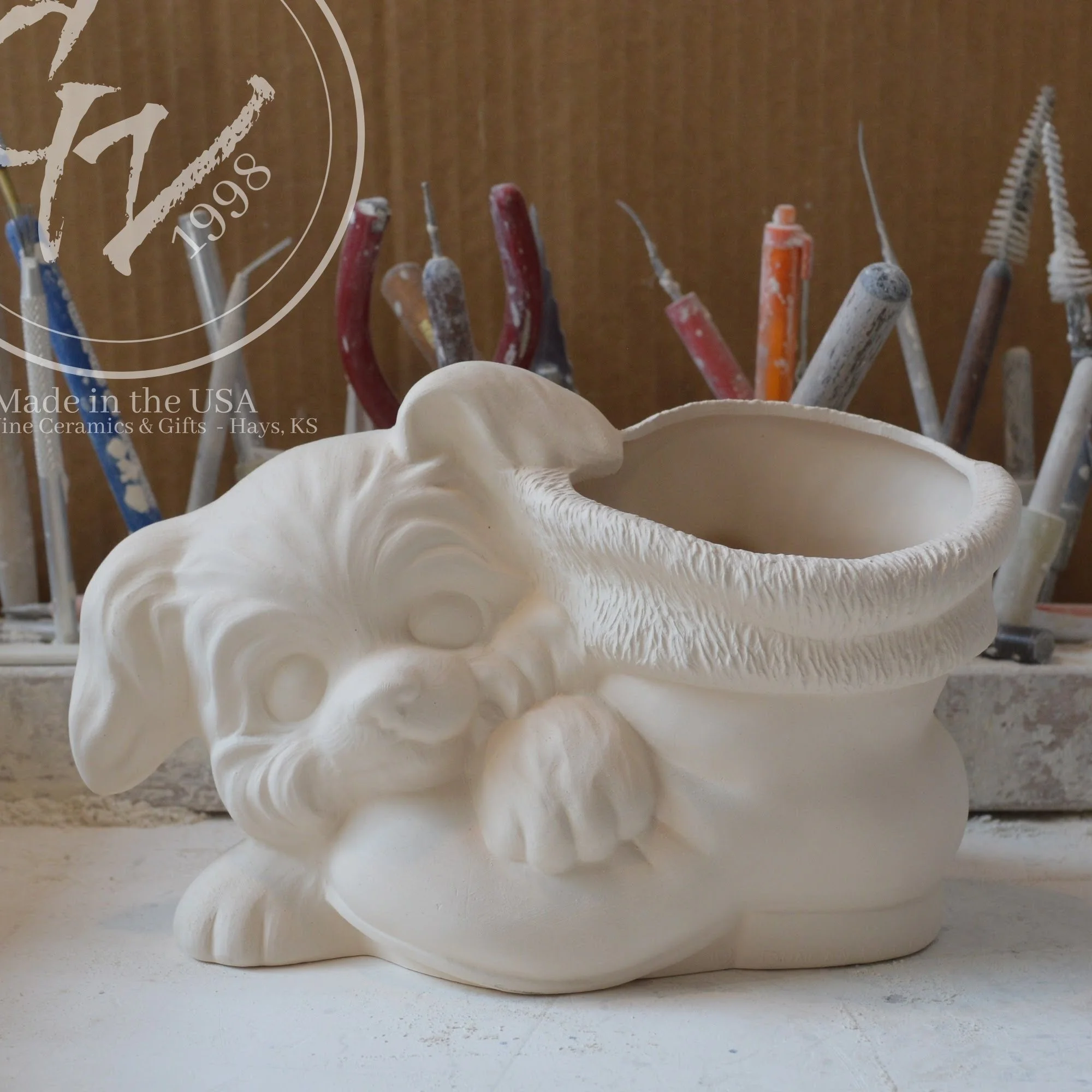 Close‑up of detailed ceramic puppy and fur‑trimmed Christmas boot