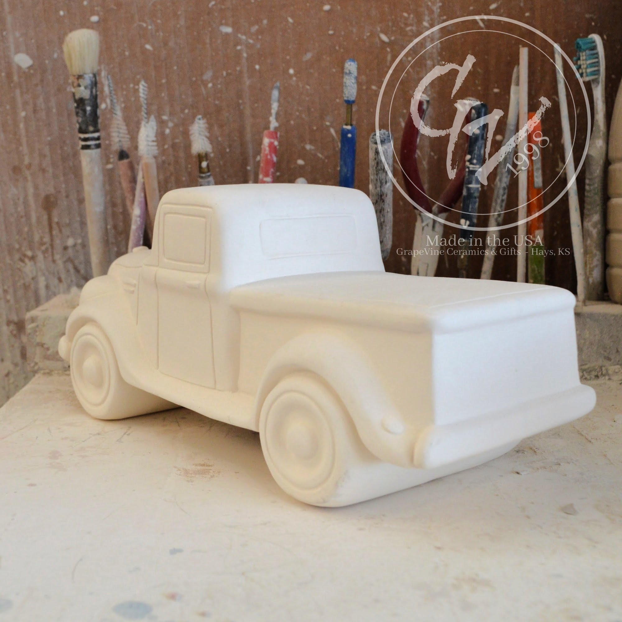 Rear angle view of the ceramic jalopy truck bisque highlighting the truck bed area.