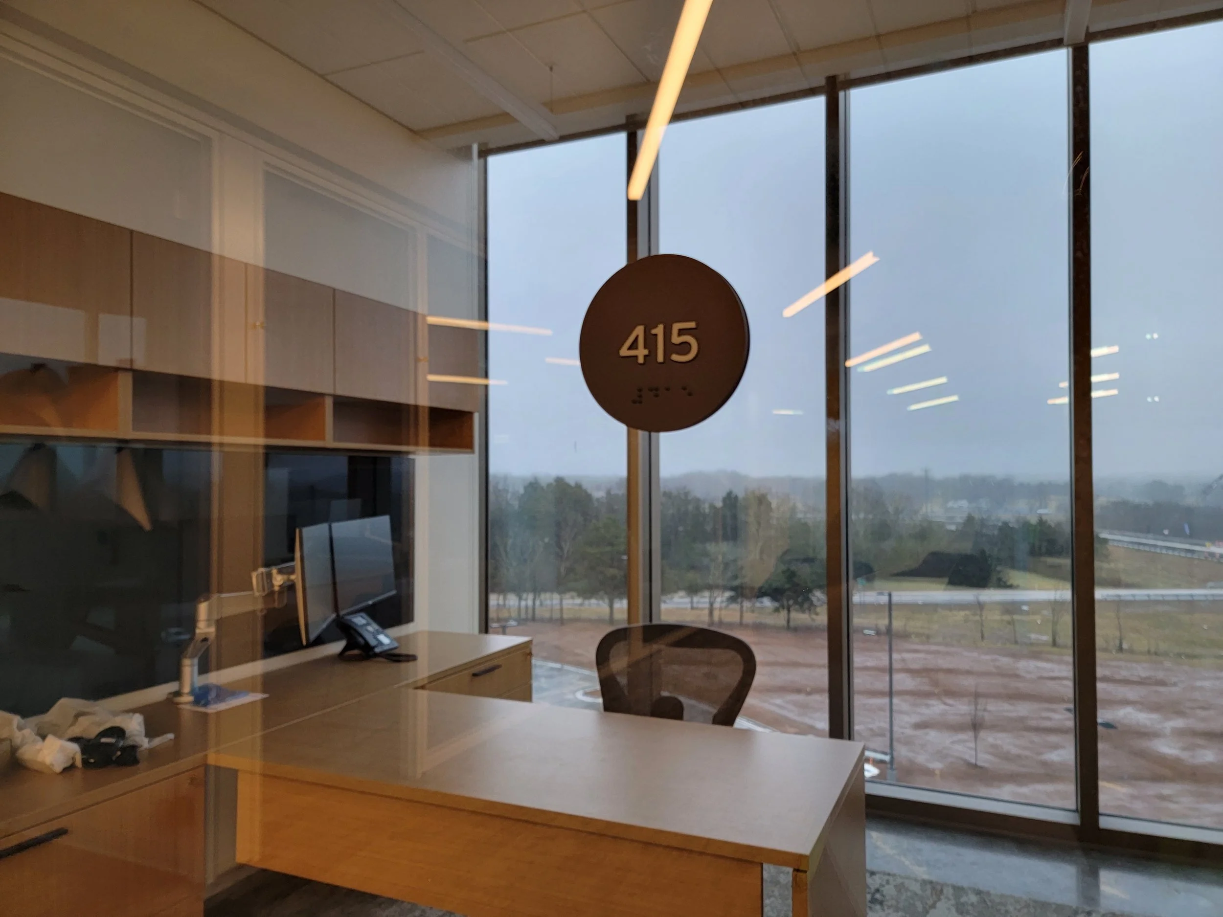 415 suite sign
ADA-Compliant Suite Sign
Glass-Mounted