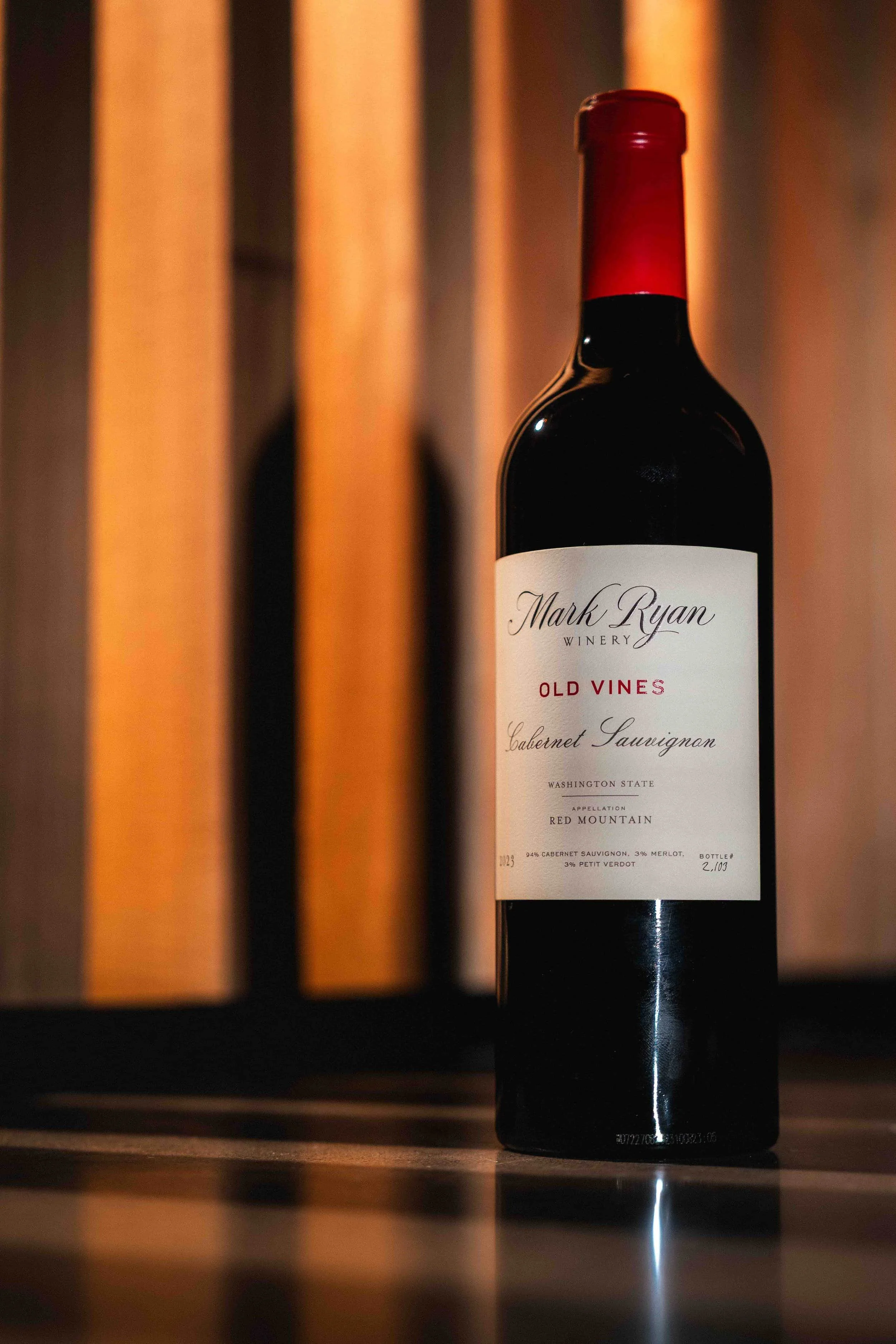 Bottle of Mark Ryan Old Vines Cabernet Sauvignon  against an architectural background.