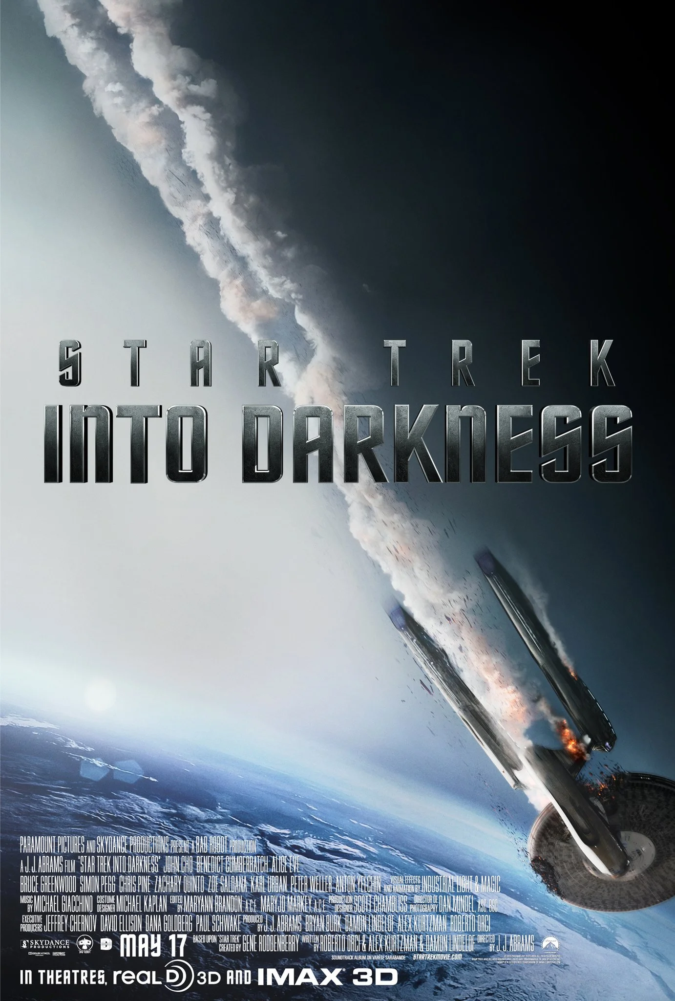 A promotional poster for the movie "Star Trek Into Darkness" showing a spaceship crashing into Earth with smoke and fire, and the title of the film in large bold letters.