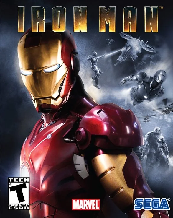 Cover art for the video game 'Iron Man' showing Iron Man in a red and gold suit with a gold helmet, set against a space-themed background with military and spaceship scenes, featuring the Marvel and SEGA logos.