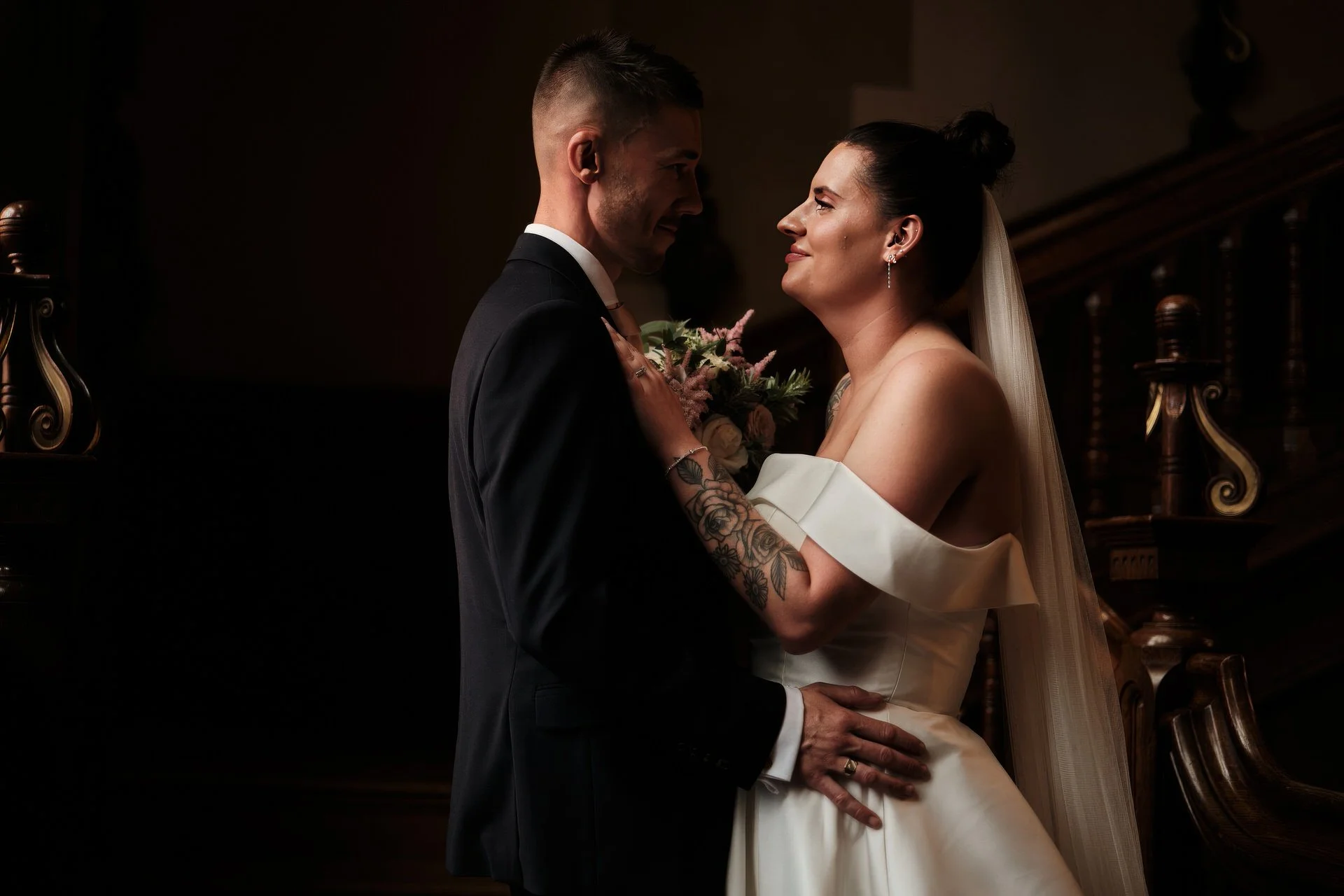 Bride and groom share a moment at their Pendley Manor Wedding