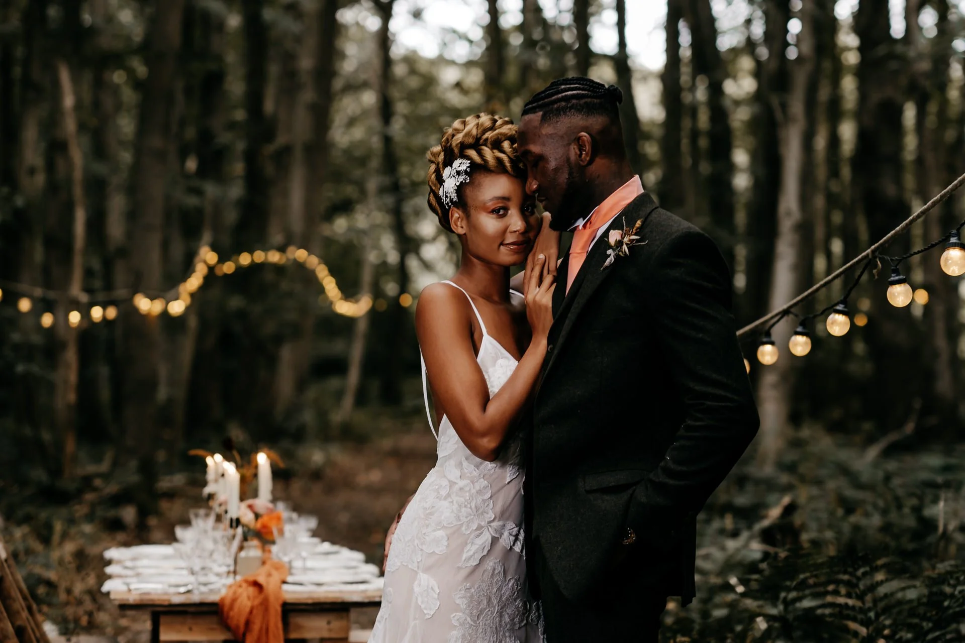 a black wedding couple pose for a styled shoot at the dreys wedding venue in kent