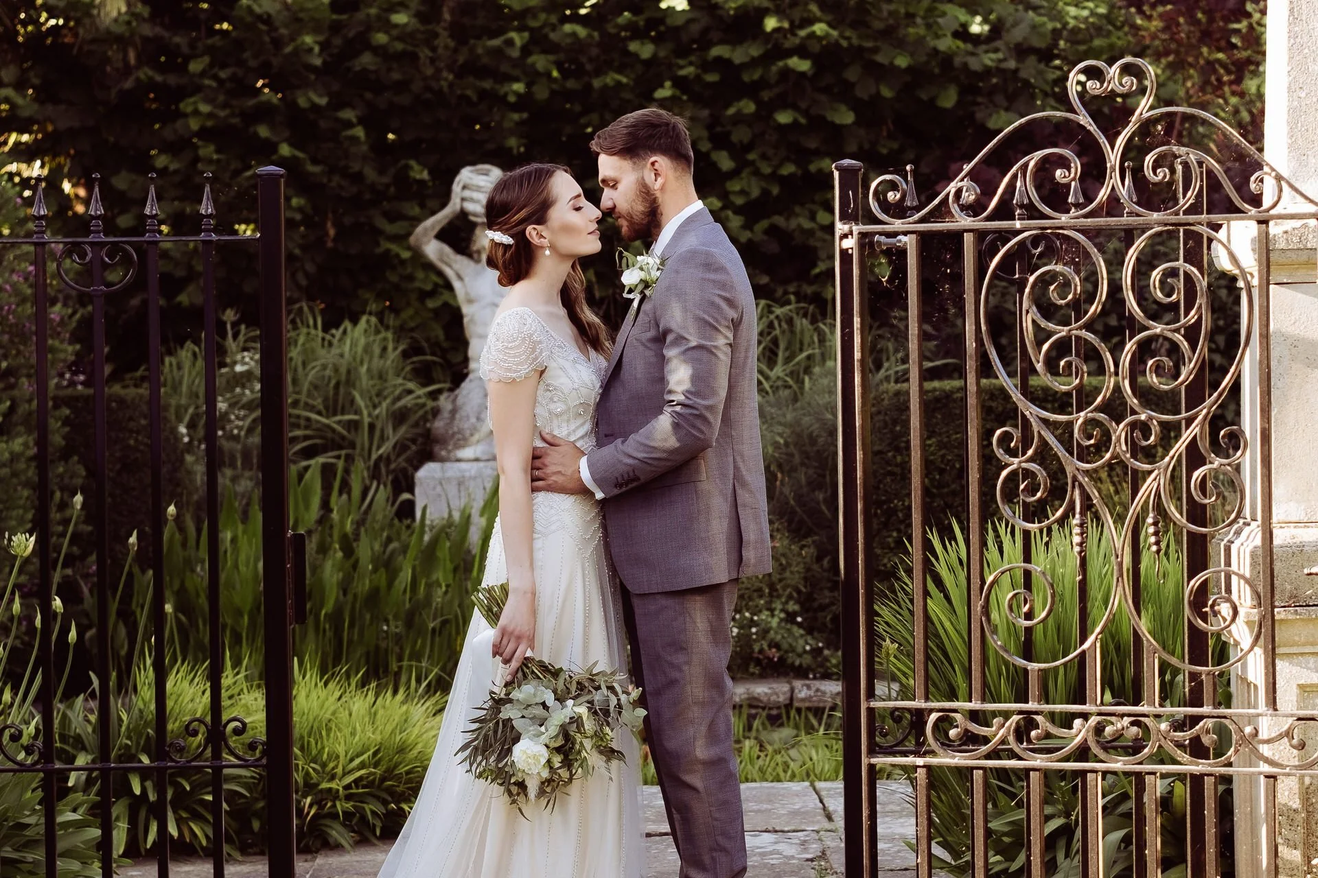 a couple pose outside chapel house estate wedding venue at a styled shoot