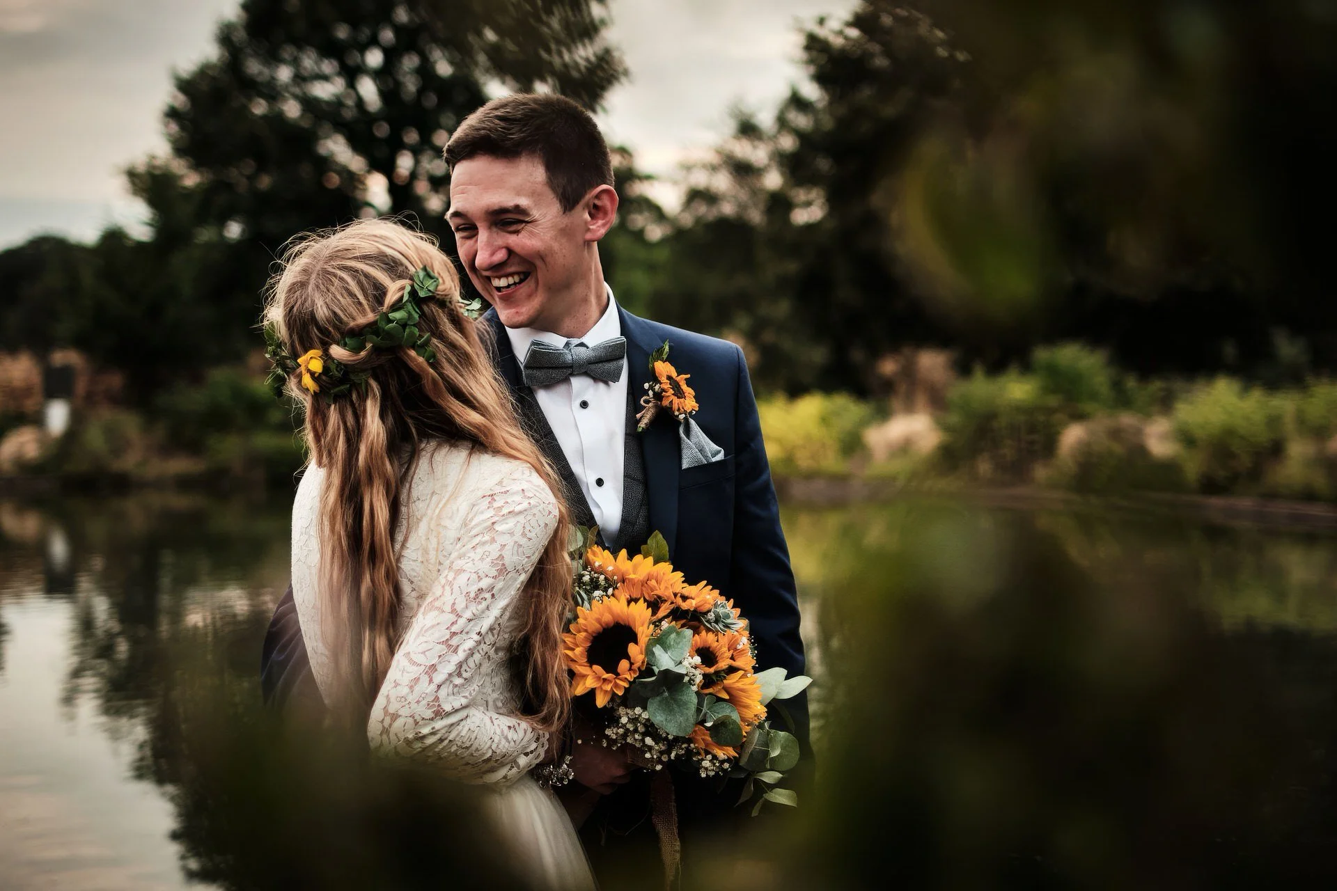 a wedding couple pose for photographs at Woburn safari park