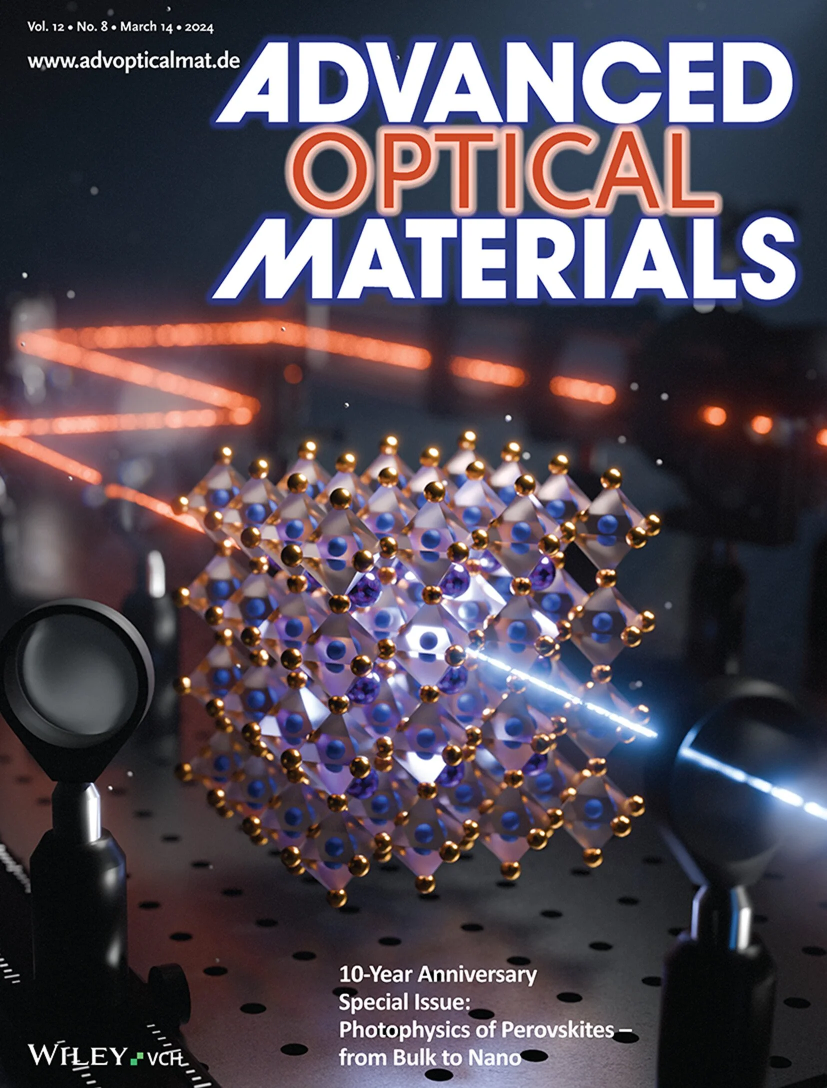 Cover of Advanced Optical Materials magazine featuring a futuristic optical setup with a crystal structure, lasers, and optical components, highlighting a 10-Year Anniversary Special Issue on Perovskites.