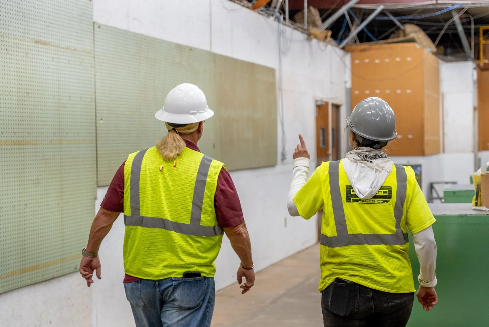 PSE Designs employee discussing electrical engineering solutions with a client