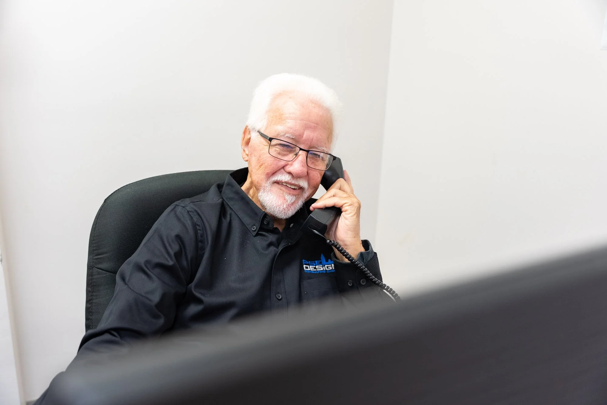 PSE Designs Consulting Engineer on a Phone Call