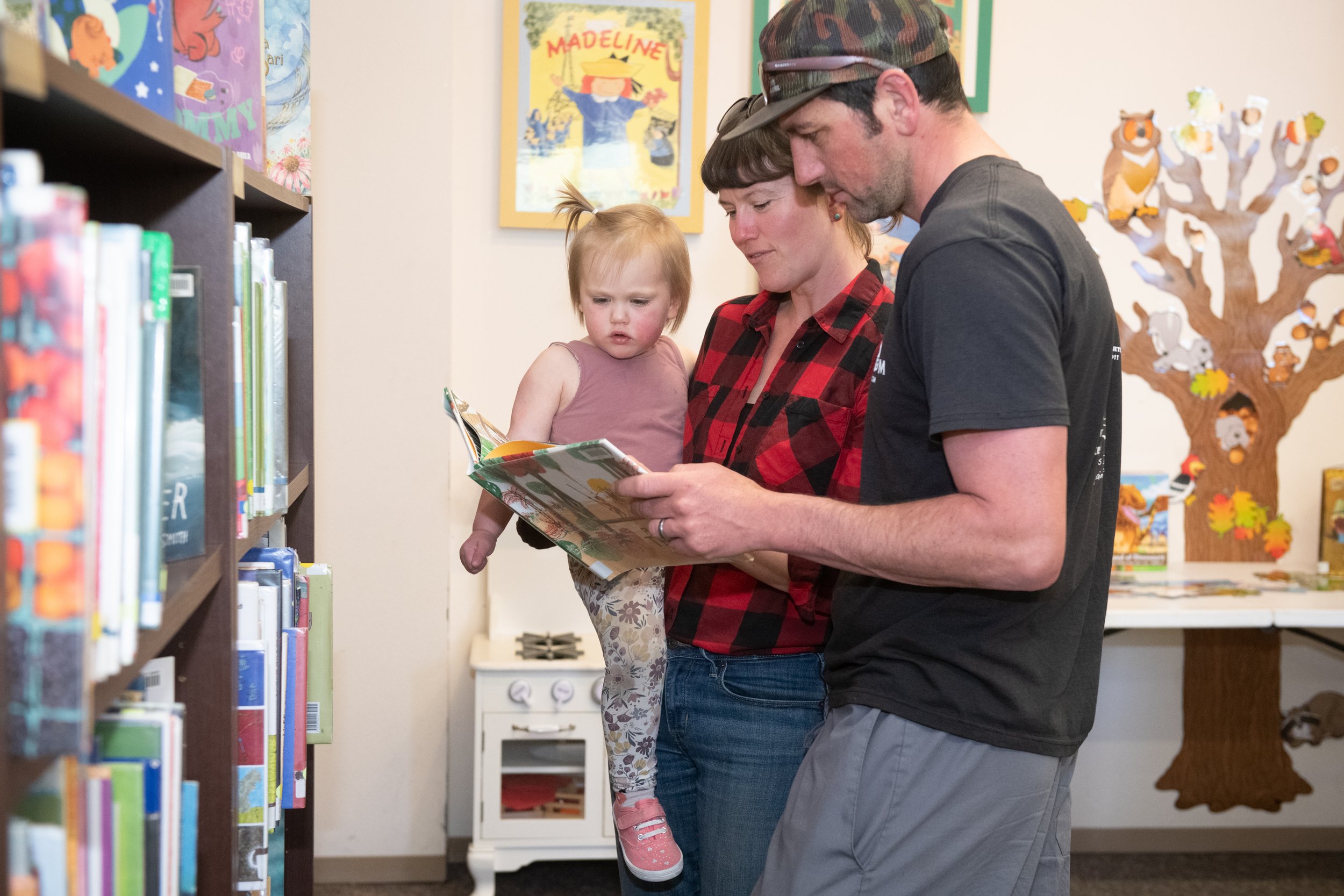 couple reading to child