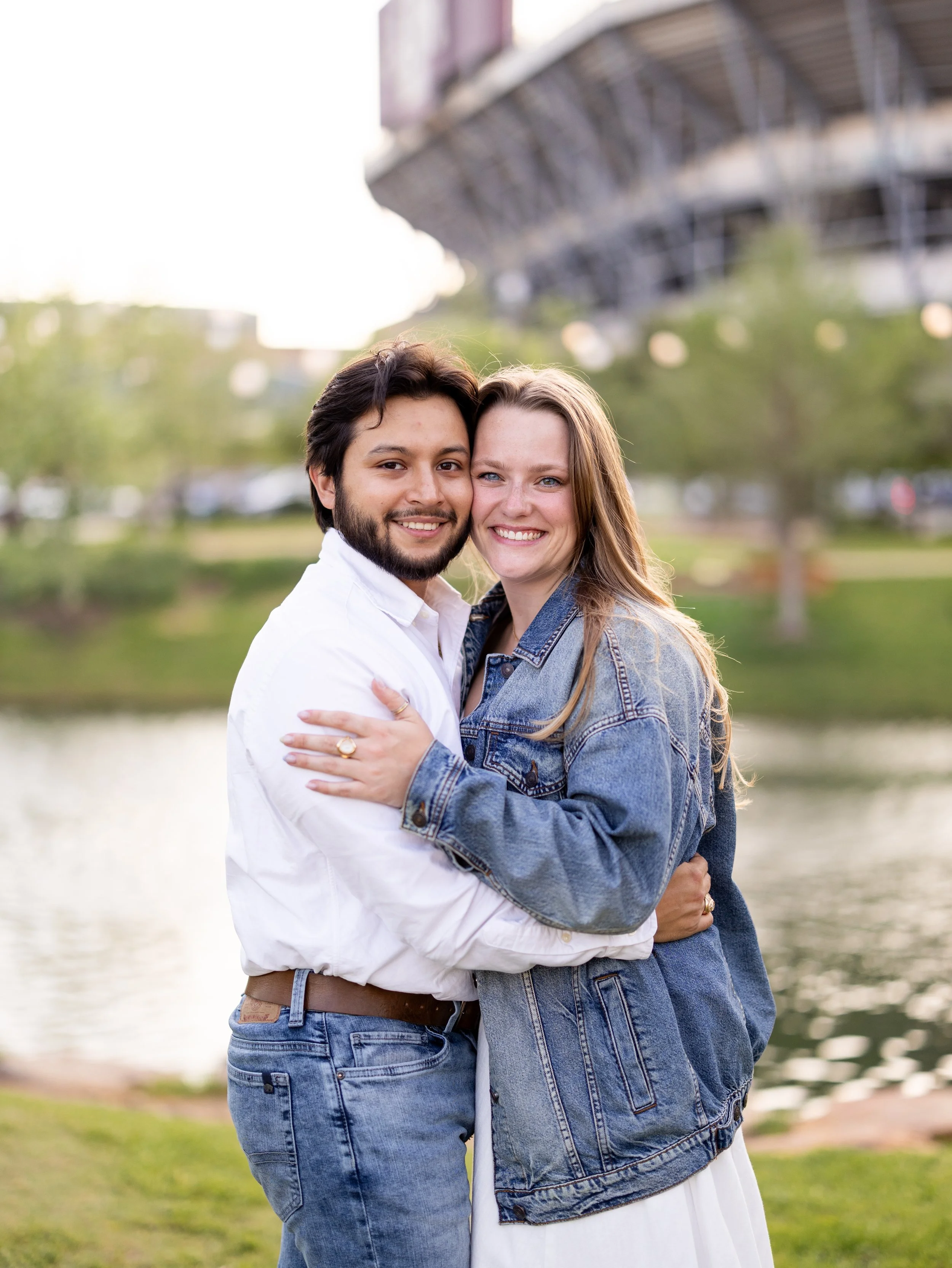 Young couple hugging outdoors photographed by College Station wedding and senior photographer Mandy Laine Photo