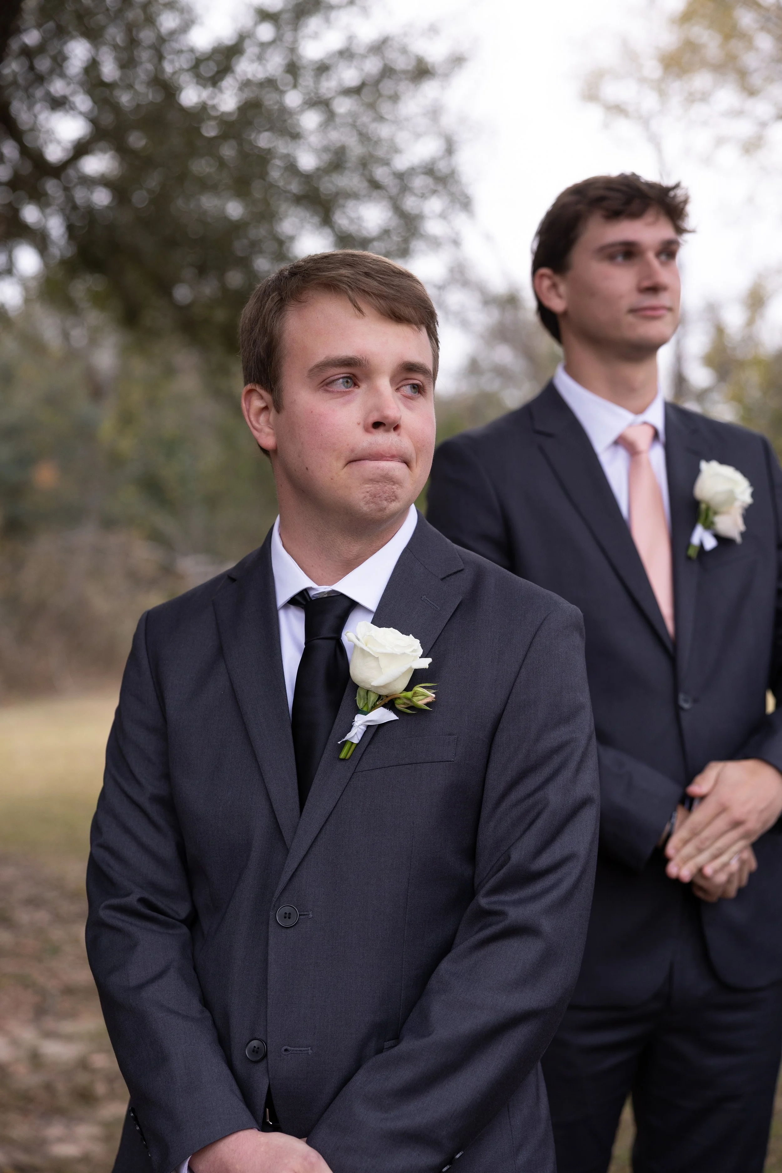 Groom outside with crying as he sees bride by Dallas wedding photographer Mandy Laine Photo, showcasing authentic, joyful wedding moments.