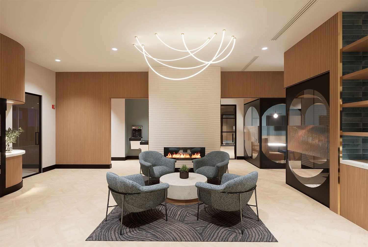 Modern hotel lobby with a circular seating area, a fireplace, and decorative lighting fixtures.
