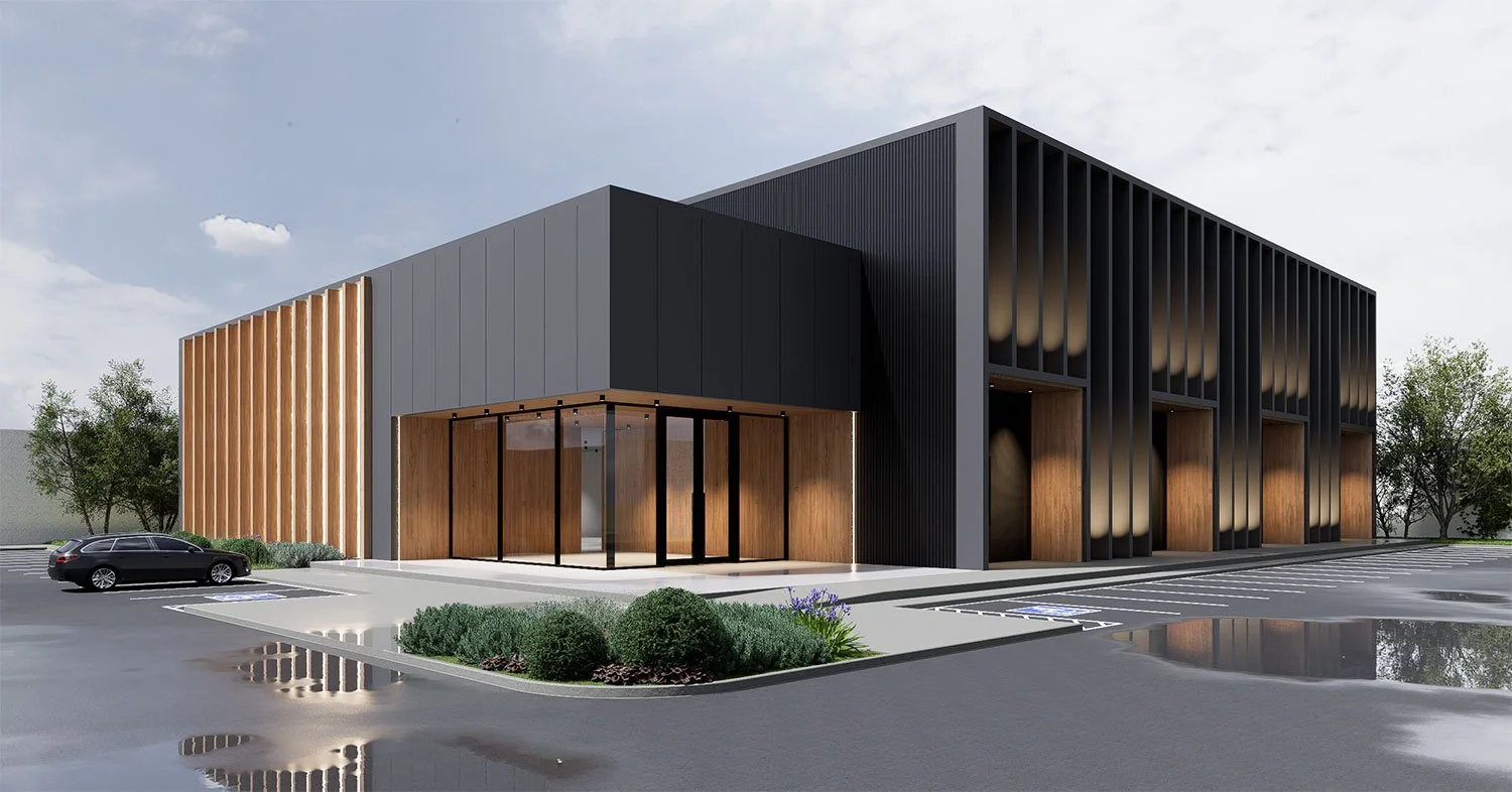 Modern commercial building with black and wood exterior, glass entrance, parking lot, and landscaping with shrubs and trees.