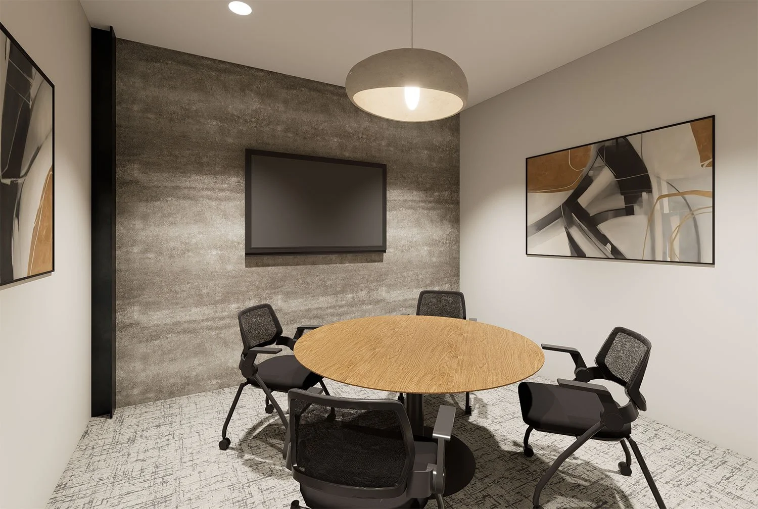 Modern conference room with a round wooden table, four black office chairs, a textured grey accent wall, two abstract paintings on the white walls, and a large flat-screen TV mounted on the wall.