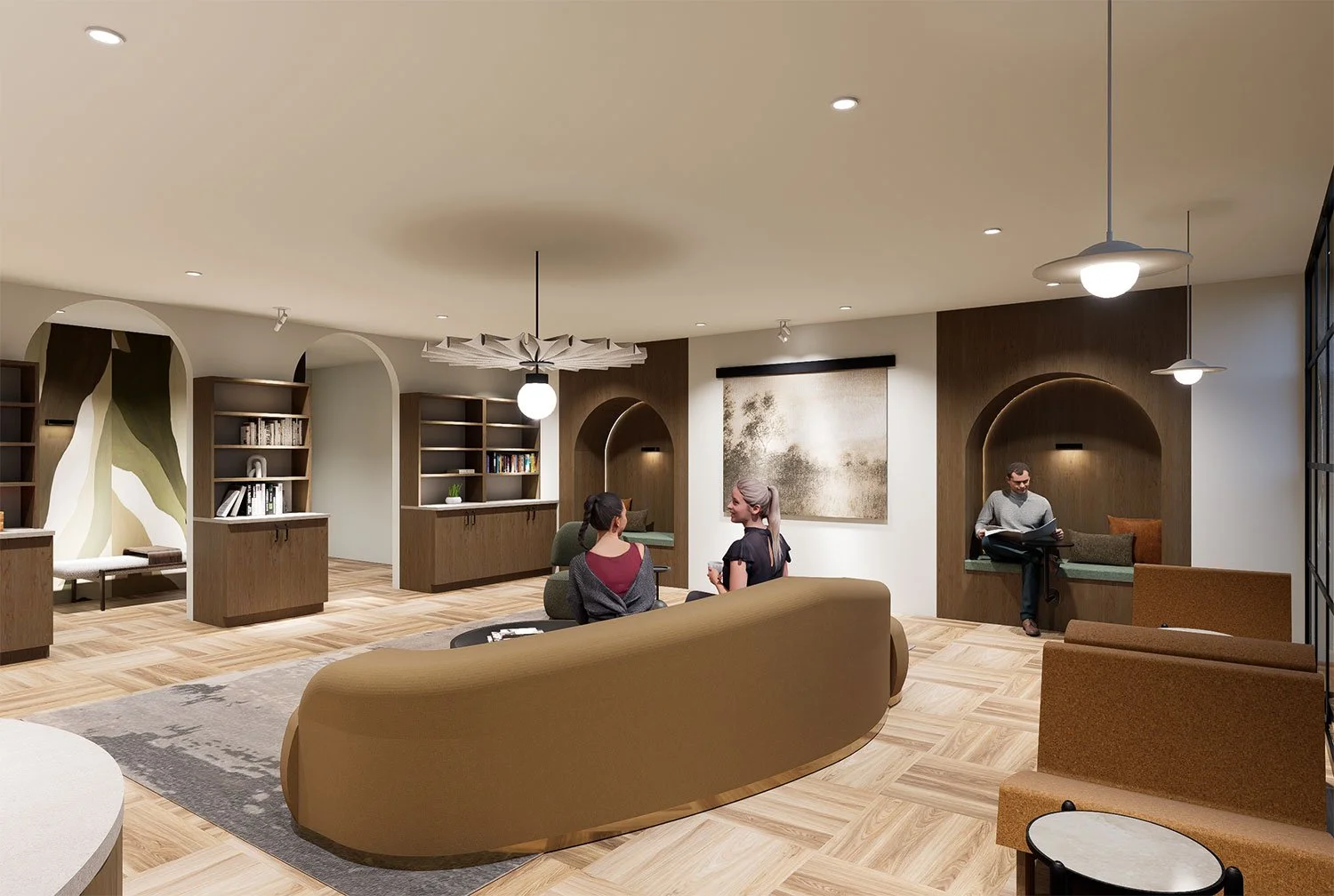 Modern living room with bookshelf alcoves, a large curved beige sofa, a rug, and three people sitting and talking, with a man reading in a nook on the right, and contemporary lighting fixtures.