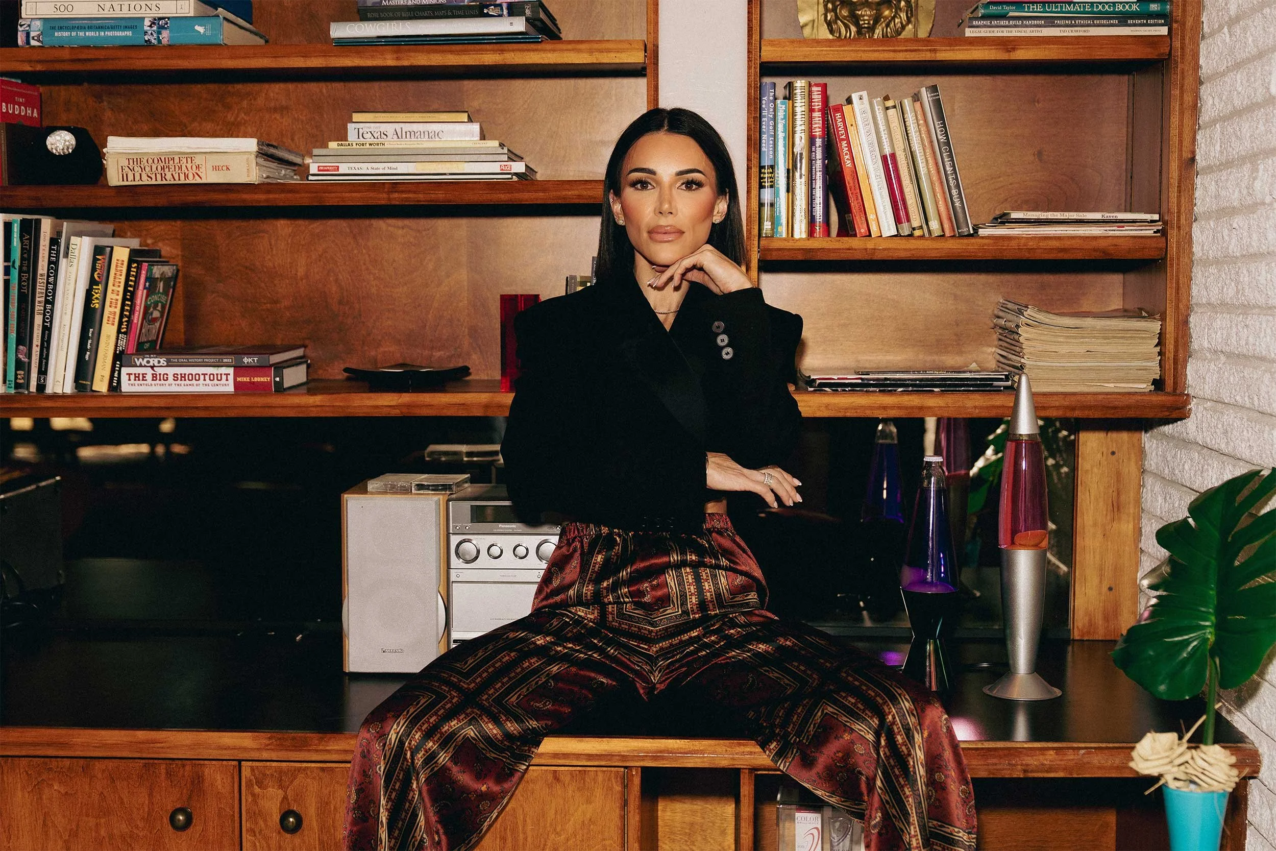 Portrait of Danielle Harbeck, founder of Maybeck Design, in a modern luxury apartment lounge designed for multifamily residential living in Dallas