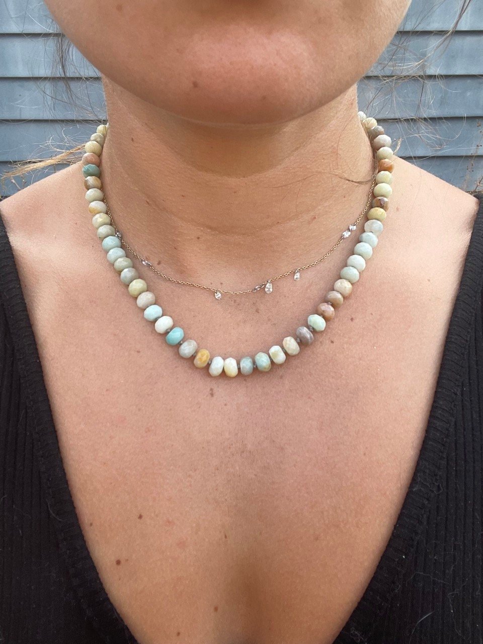 woman wearing necklace made of semiprecious gemstone mixed amazonite hand knotted with silk thread