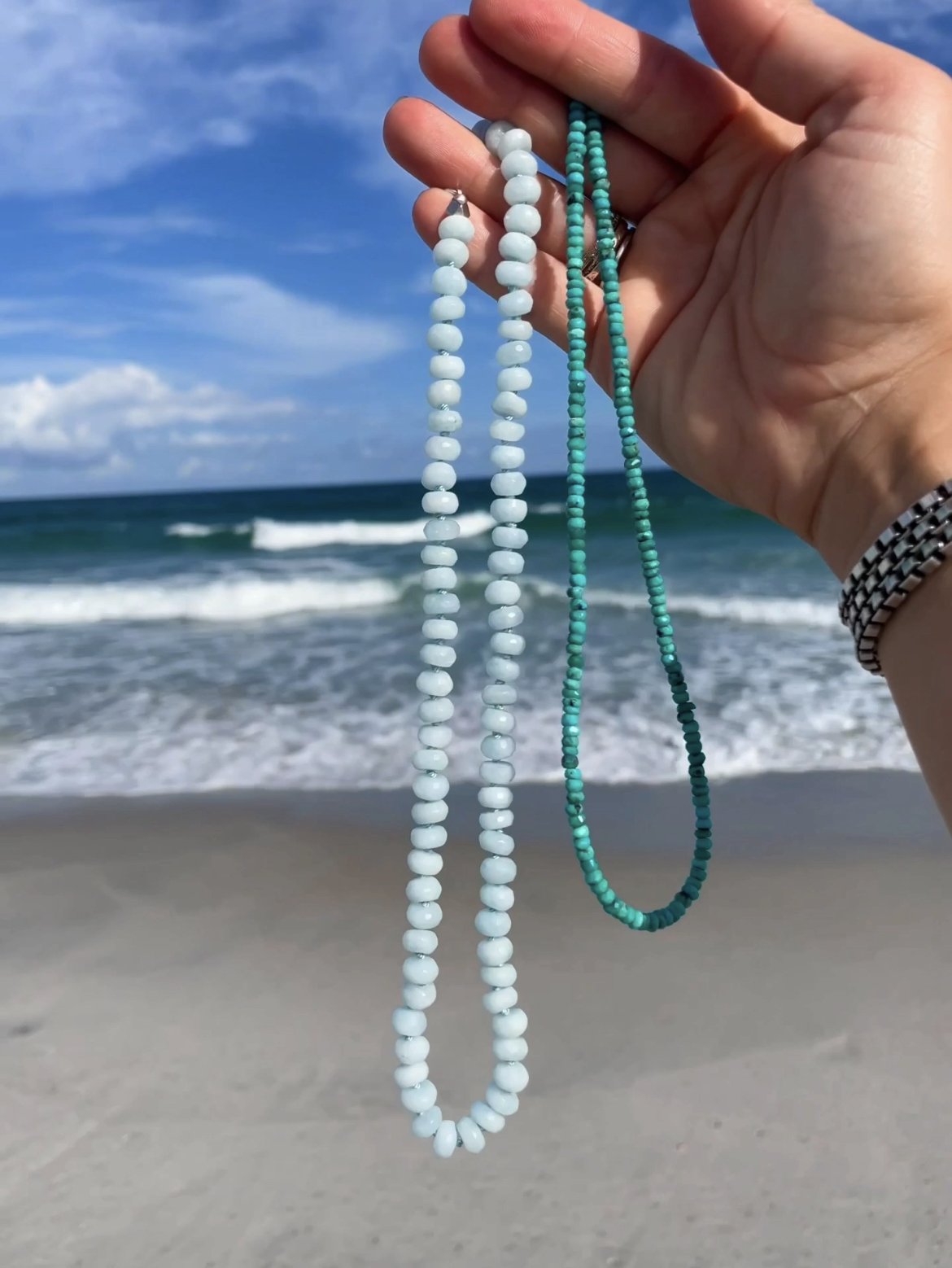 handmade necklace of semiprecious gemstone aquamarine knotted on silk thread with turquoise necklace at the beach