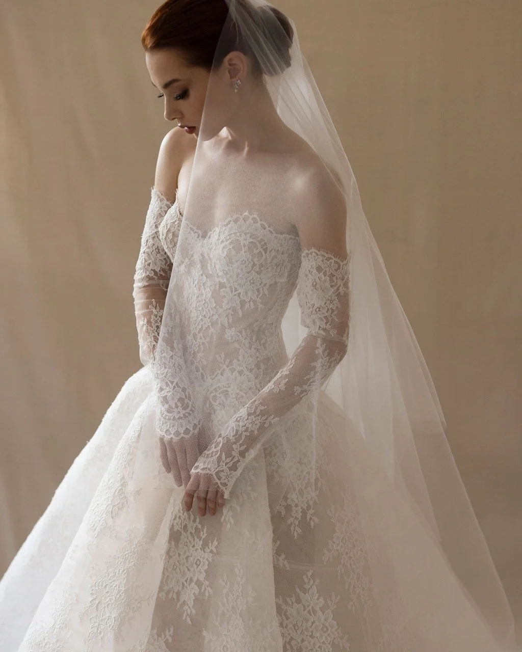 An ode to everlasting love. The Alexandra gown by @moniquelhuillierbride  pairs a graceful strapless drop waist with a voluminous circular skirt, adorned in re-embroidered lace

#helenrodriguesbridal #moniquelhuillier #laceballgown