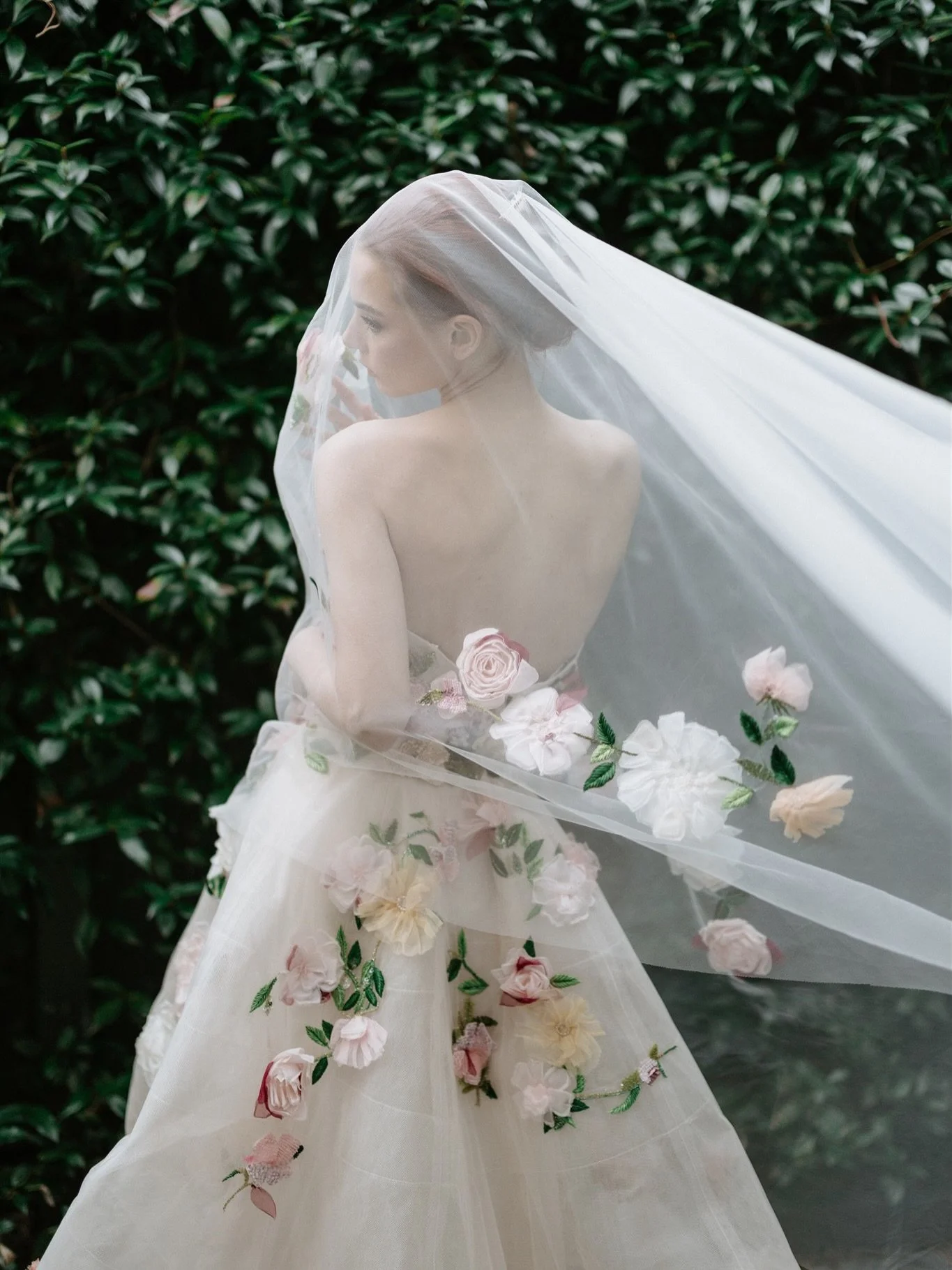 The Monique Lhuillier English Rose veil with three-dimensional floral embroidery, a one of a kind finishing piece to transcend seasons and generations. 

Only at Helen Rodrigues Bridal