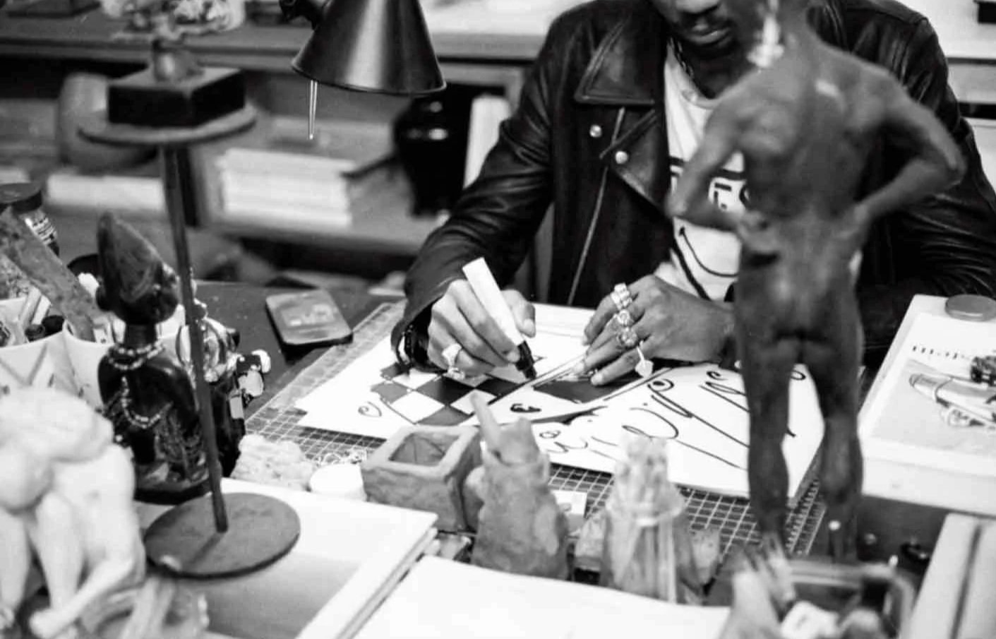Moyosore Martins in his studio drawing. He is known for his unique afro-futurist iconography.