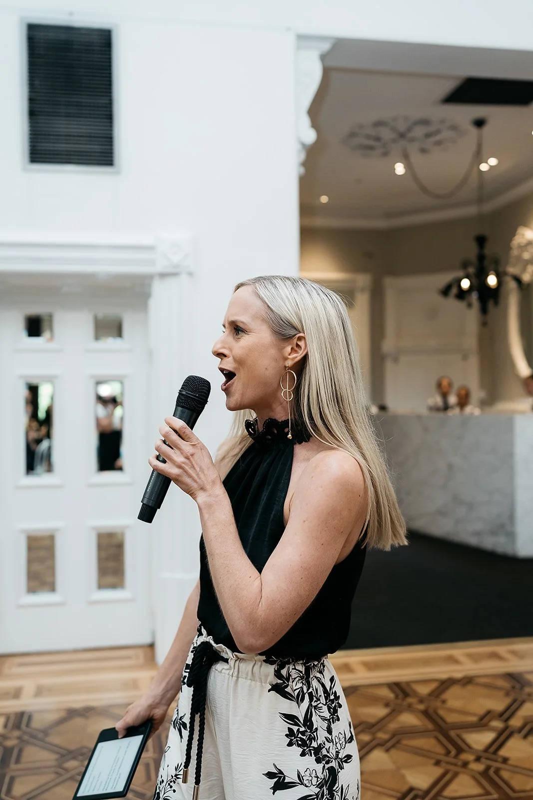 Celebrant and Melbourne wedding MC Kate Mac energising the room during a reception at Quat Quatta