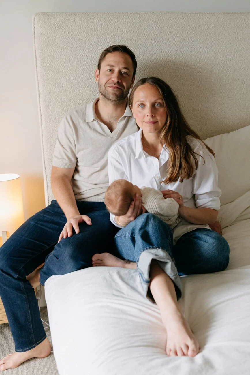 family-portraiture-mother-father-baby-on-bed.001.jpg