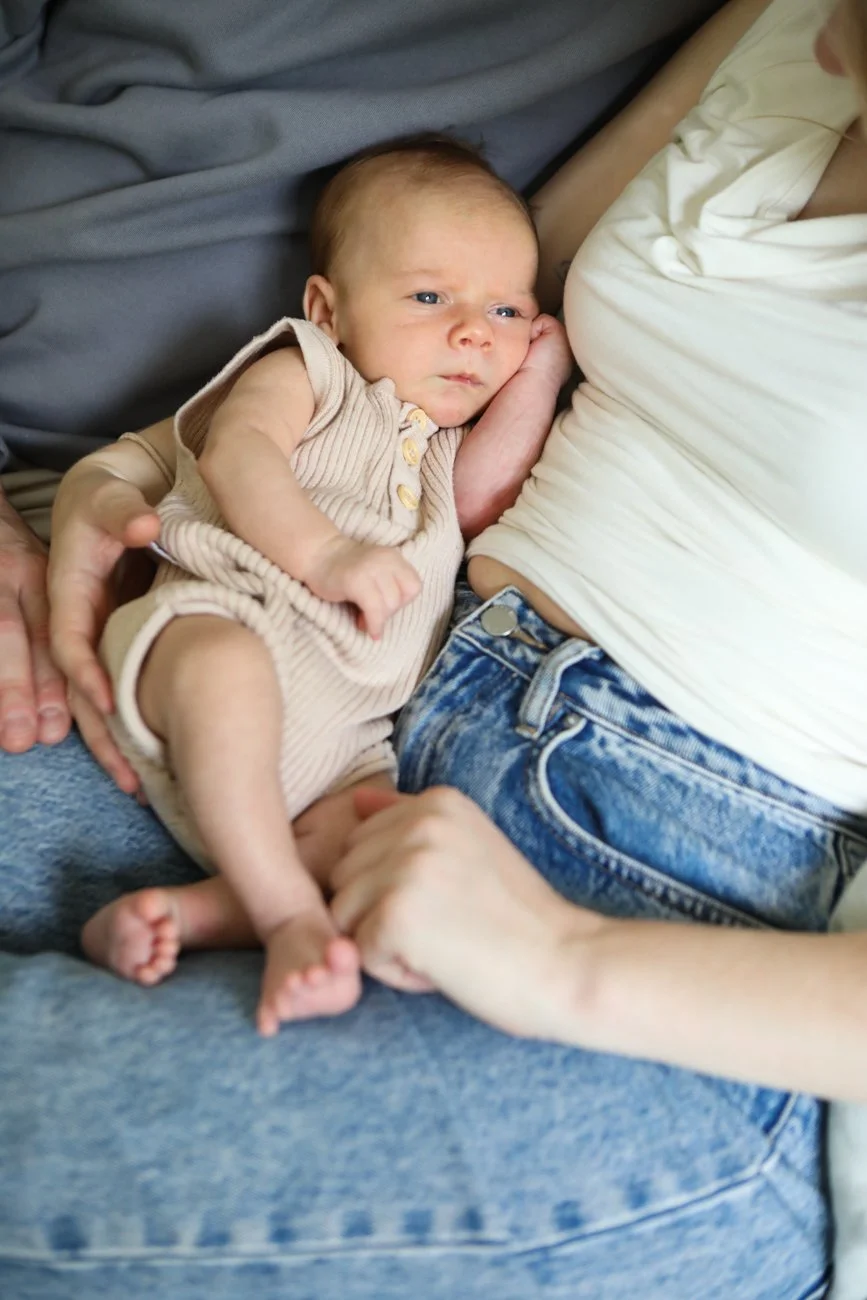 family-portraiture-mother-father-with-newborn-on-lap.001.jpg