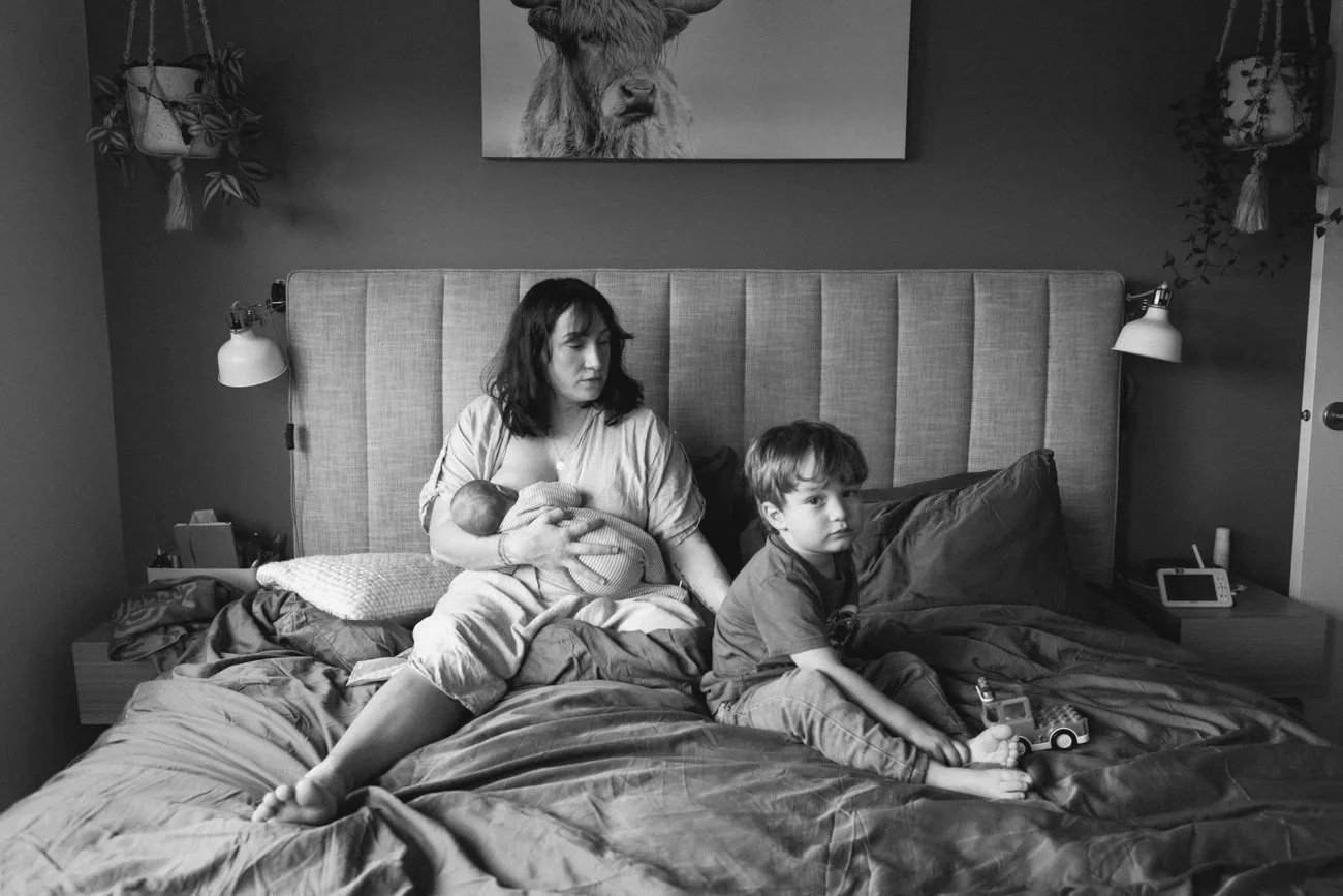 family-portraiture-family-resting-on-bed.001.jpg