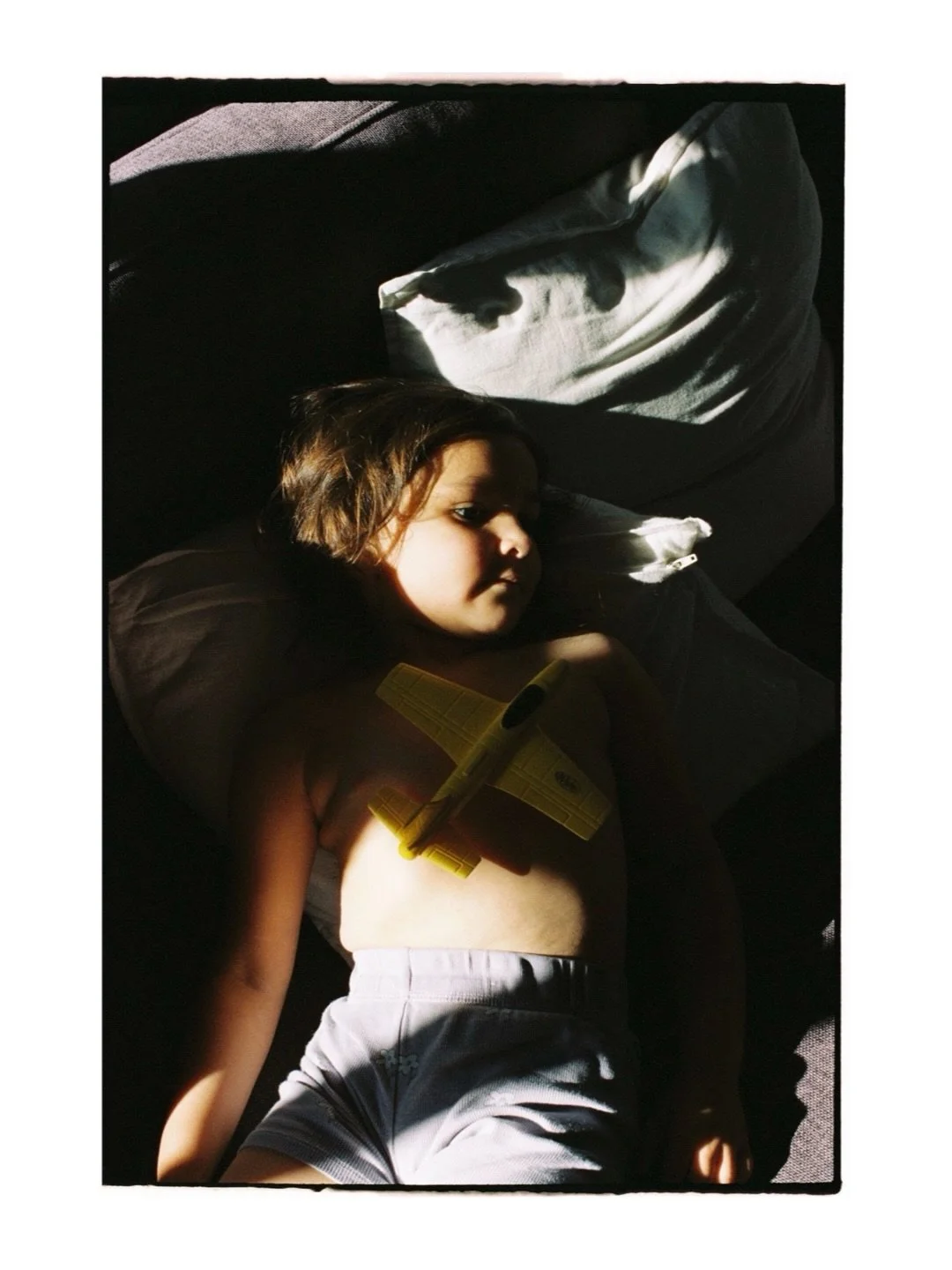 Childhood asks so little of a moment. A shaft of light like from a dream. A small plane. Somewhere to imagine going. 

For #PVMondayDreams @photovogue 

Process and scanning thanks to @ikigaifilmlab 

-

Rochelle Tissa is a Melbourne-based photograph