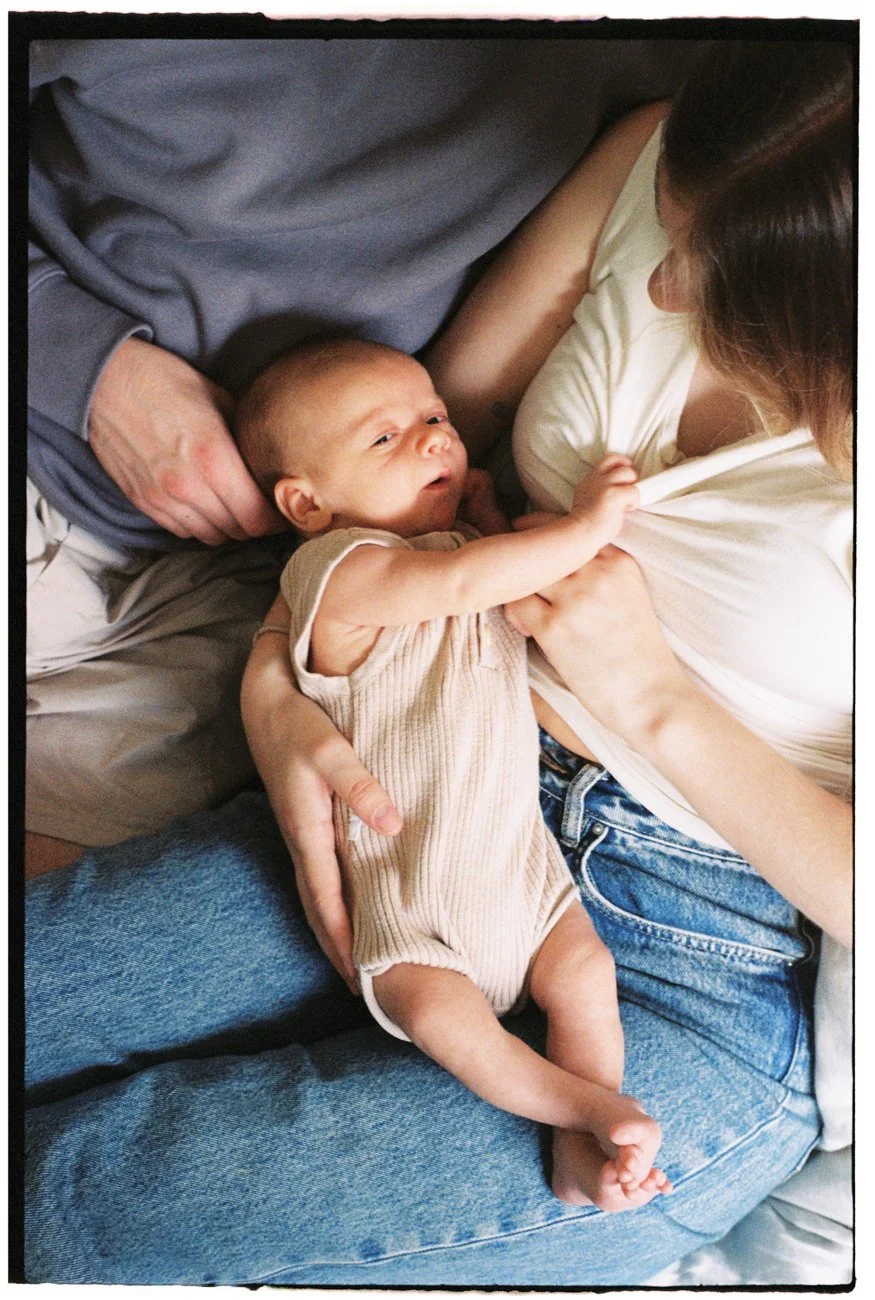 family-portraiture-mother-father-holding-newborn.001.jpg