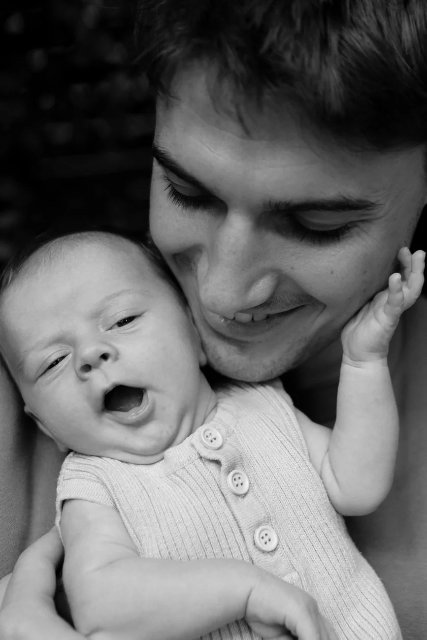 family-portraiture-mother-father-with-smiling-newborn.001.jpg