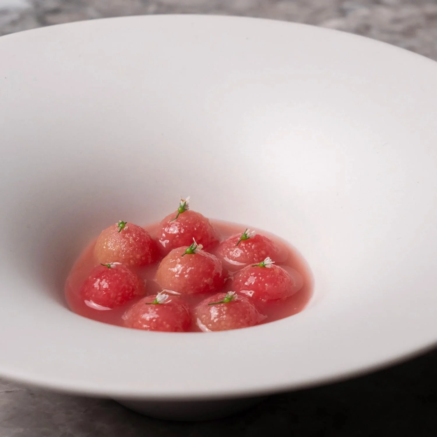 Red fruit dessert in a wide white bowl at Royd