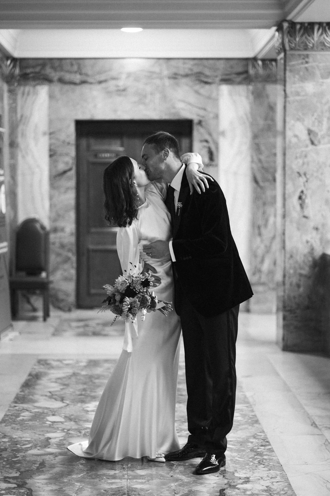 wedding photography of couple walking and kissing at Wandsworth Town Hall