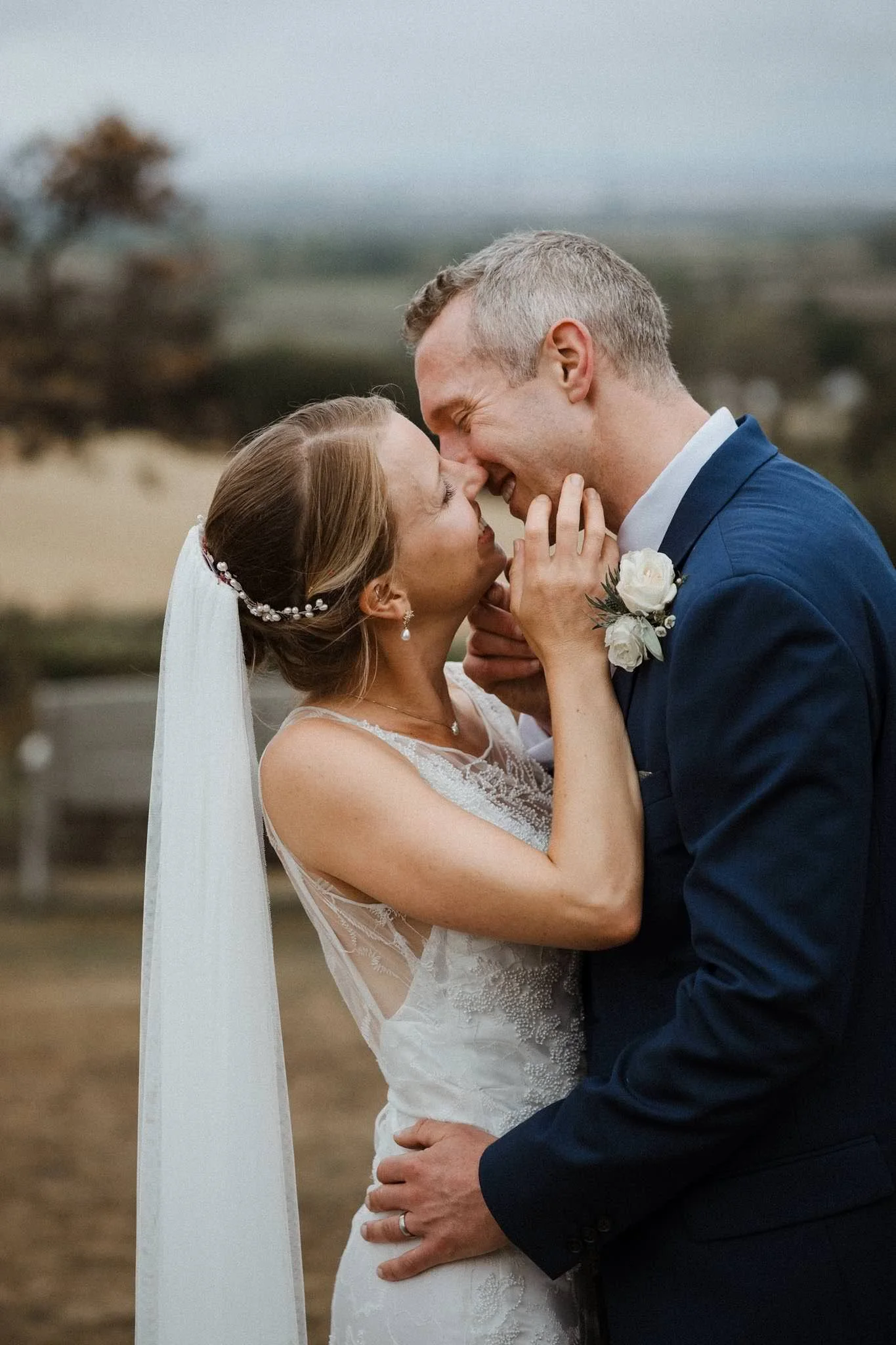Photograph of bride and groom kissing at their wedding in Bristol
